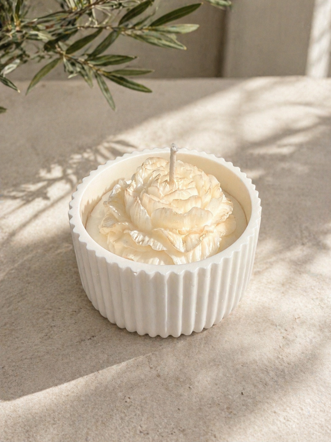 Ivory Petal Luxury Bloom Vessel Candle in white ribbed container with sculpted cream flower top.