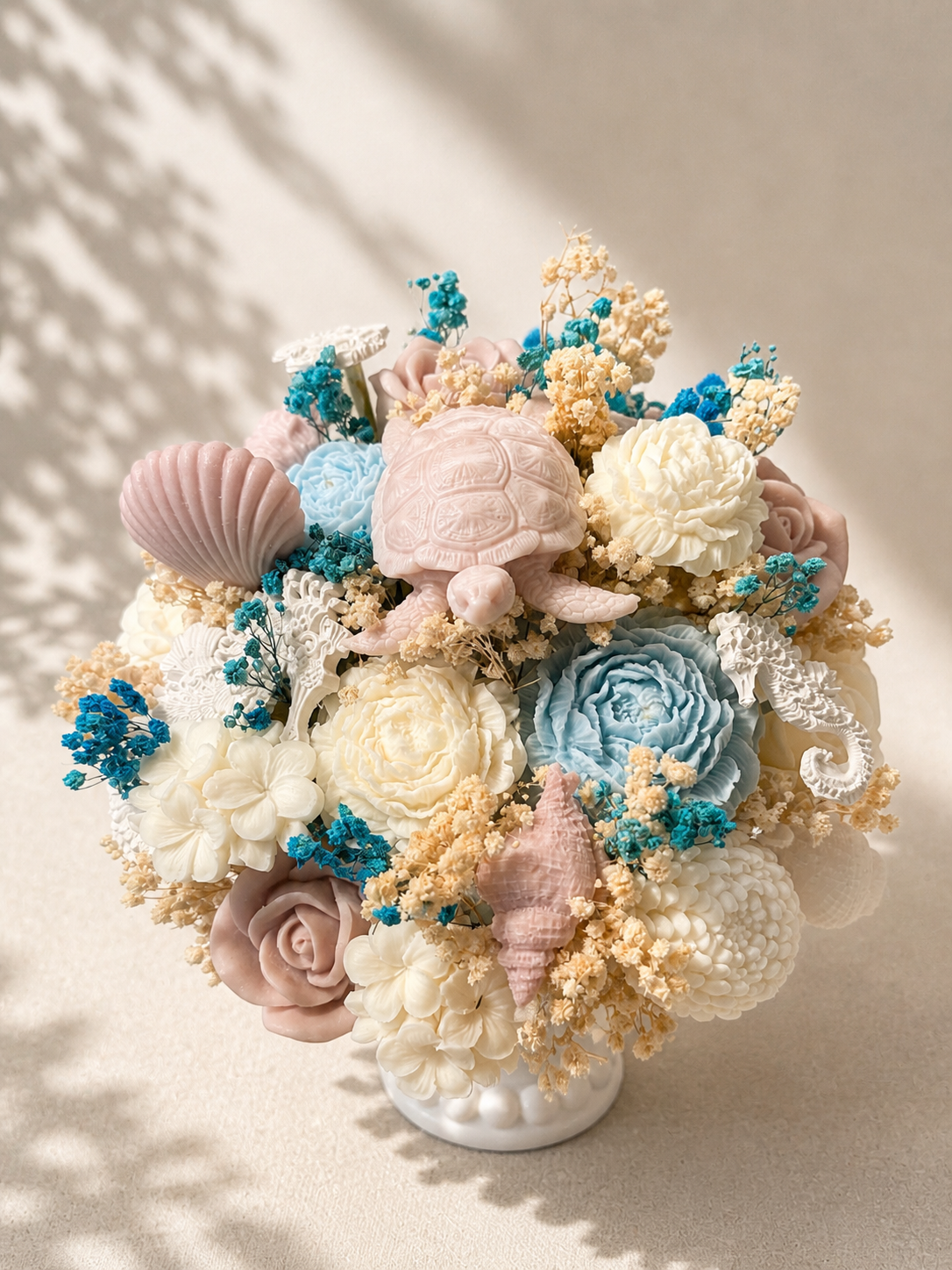 Luxury coastal candle bouquet with handcrafted floral wax details, seashell accents, and pastel ocean-inspired décor by Candle Club Company in Connecticut