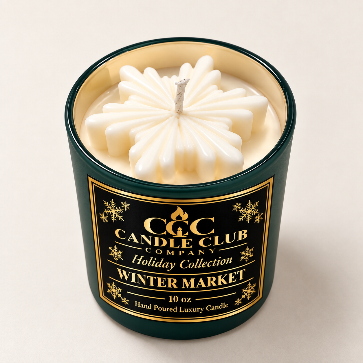 Evergreen green Snowfall Glow 10 oz soy candle with white snowflake wax topper