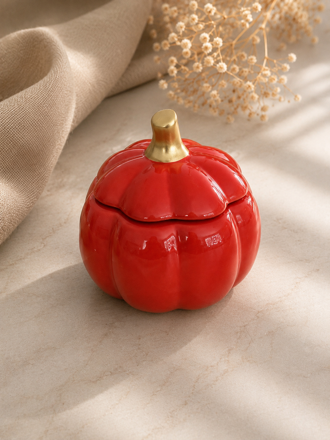 Golden Harvest pumpkin 8 oz soy candles in glossy autumn orange ceramic with gold stems lid, hand-poured in Farmington, Connecticut.