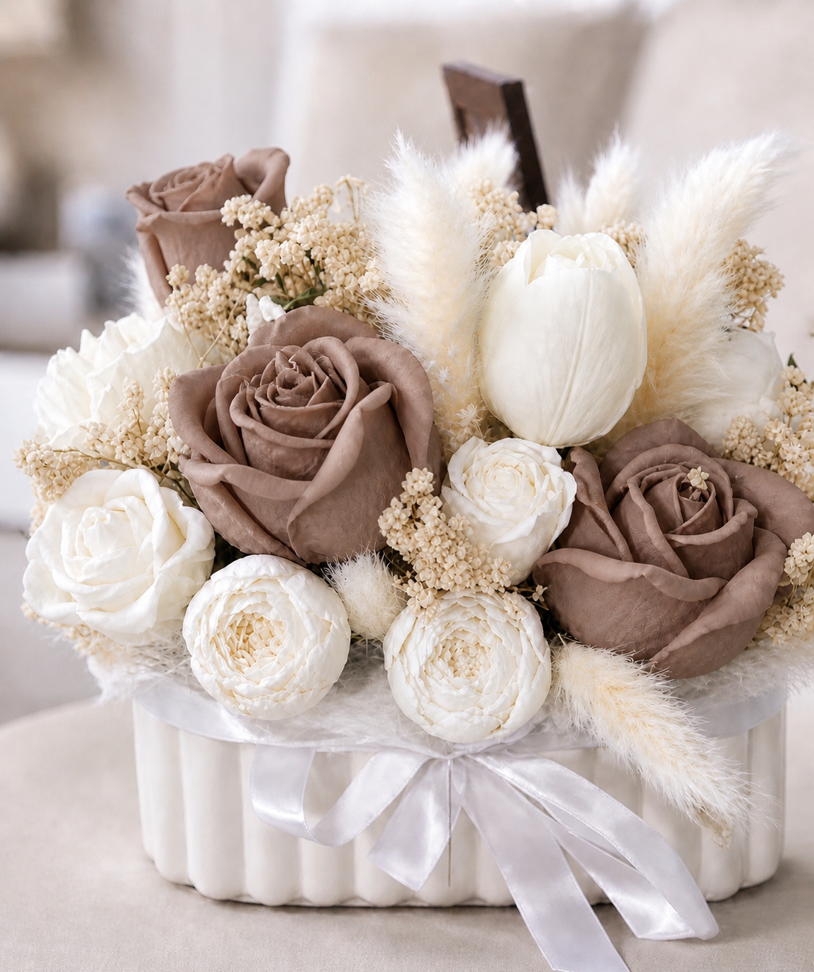 Luxury soy candle flower arrangement with mocha brown and ivory roses in a decorative white vessel, elegant handmade centerpiece