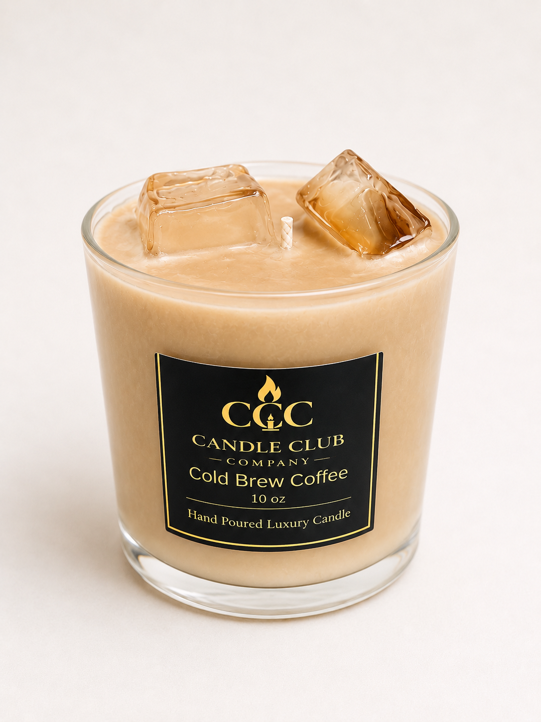 Hand-poured luxury cold brew coffee candle in clear glass jar with realistic iced coffee design and jelly ice cubes