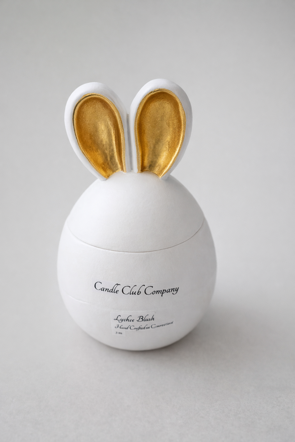 Luxury white bunny egg candle with gold ears handmade by Candle Club Company in Connecticut – 5 oz soy wax Easter decor