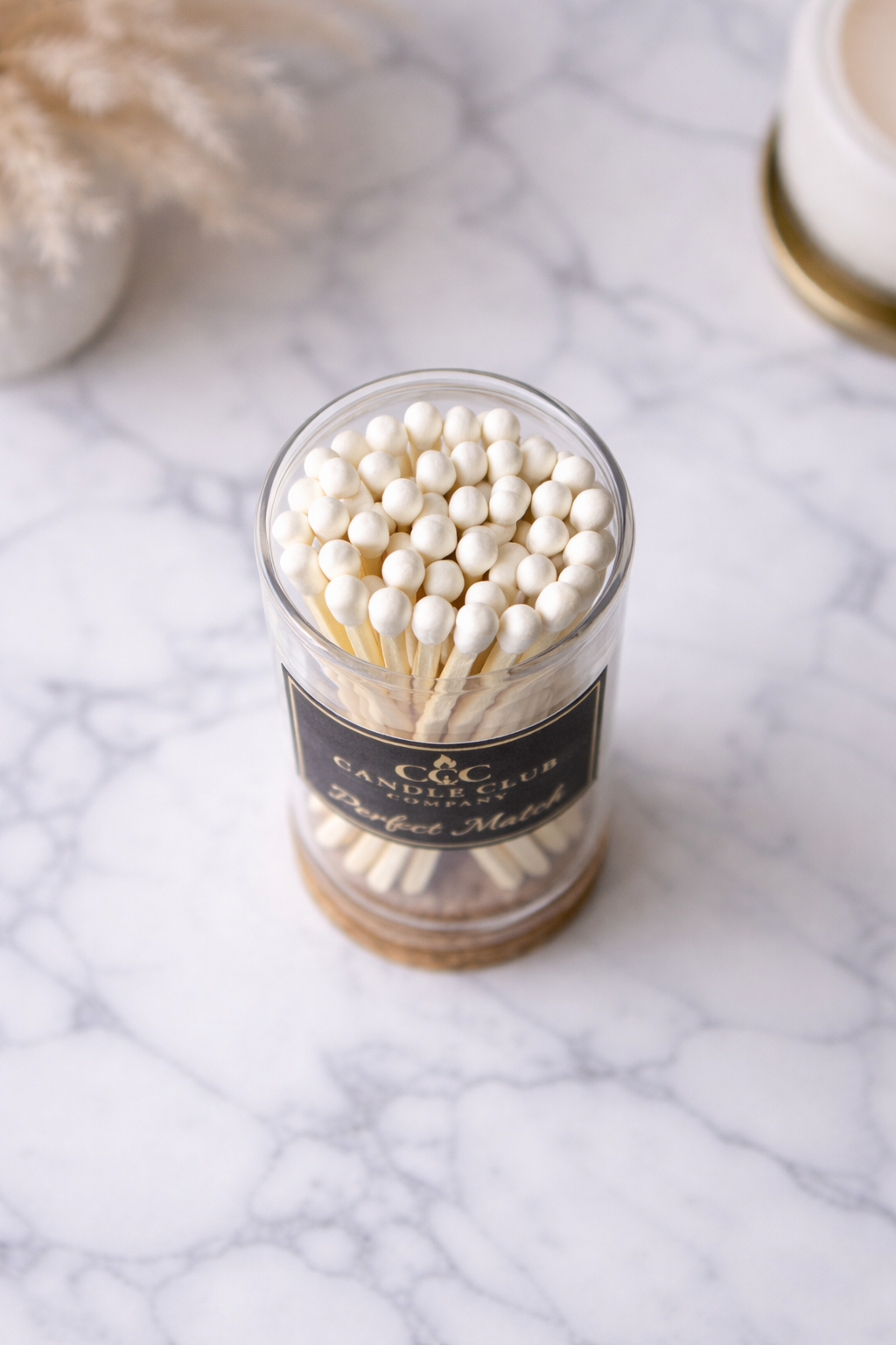 Top view of luxury wooden candle matches in glass container styled for modern home décor