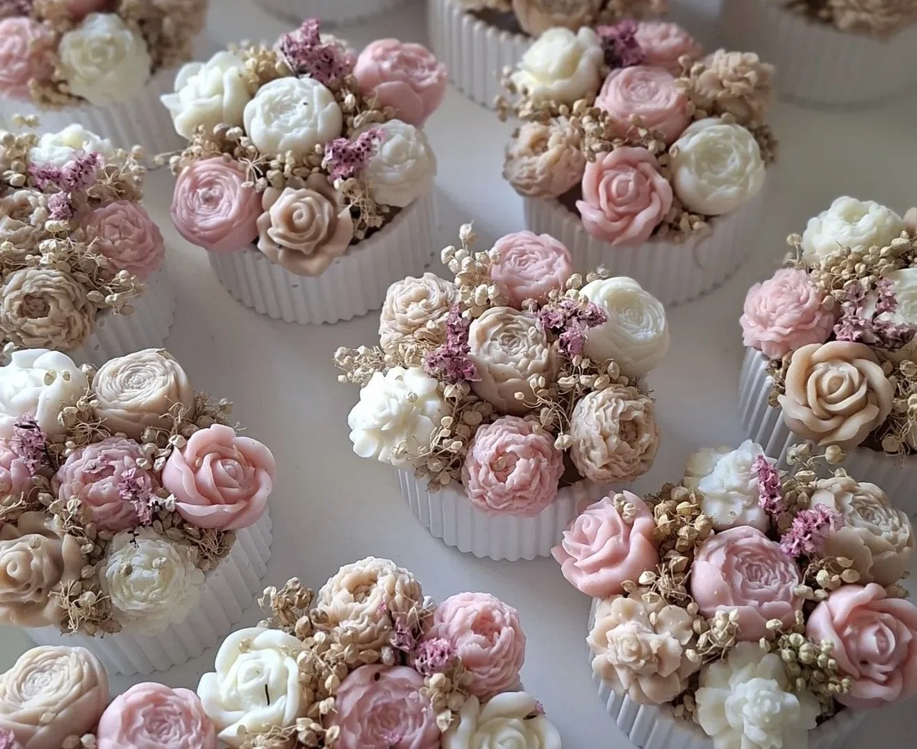 Handcrafted floral-inspired candles arranged in stunning bouquets, featuring delicate rose shapes in soft pink, cram, and blush tones. Each candle bouquet is made with vegan soy wax and designed to add a touch of elegance and artisanal beauty to any 
