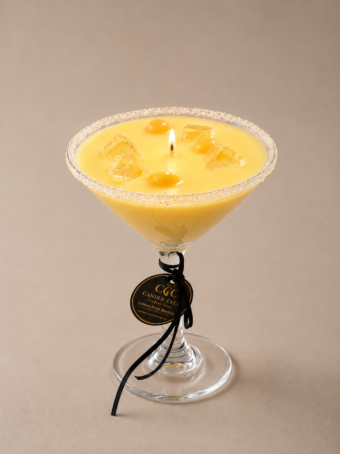 Lit Lemon Drop Martini candle featuring realistic cocktail styling and luxury glass vessel