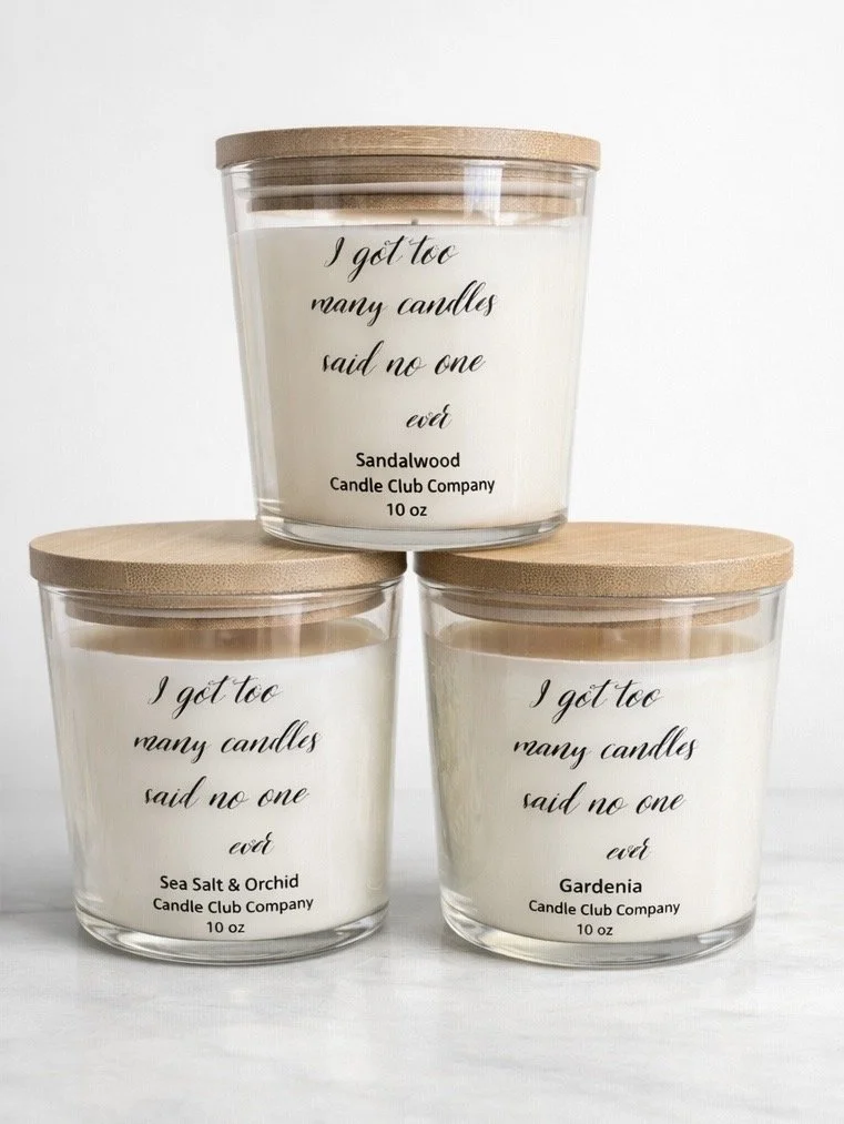 Luxury soy candles stacked with bamboo lids reading “I got too many candles said no one ever” by Candle Club Company Farmington Connecticut