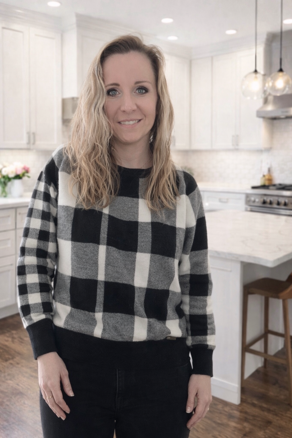 Hand-poured soy candle maker from Candle Club Company standing in a bright kitchen in Connecticut
