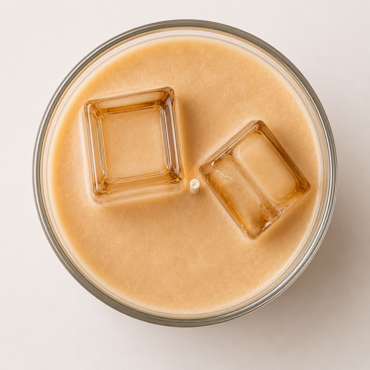 Top view of hand-poured cold brew coffee candle with transparent jelly ice cubes and creamy iced coffee wax
