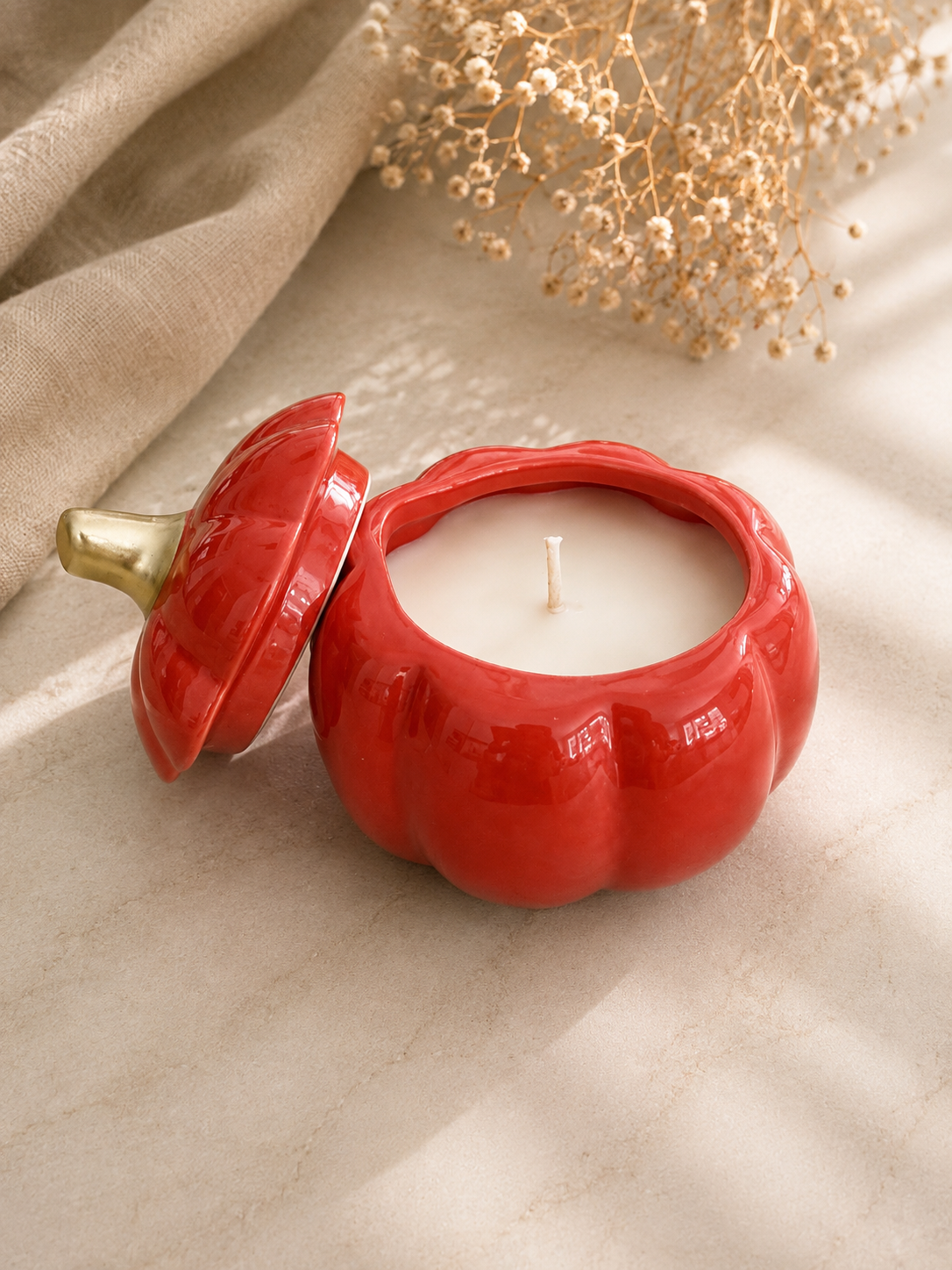 Golden Harvest Pumpkin 8 oz soy candle in orange ceramic pumpkin vessels with removable gold-stems lid, handmade in Farmington, CT.