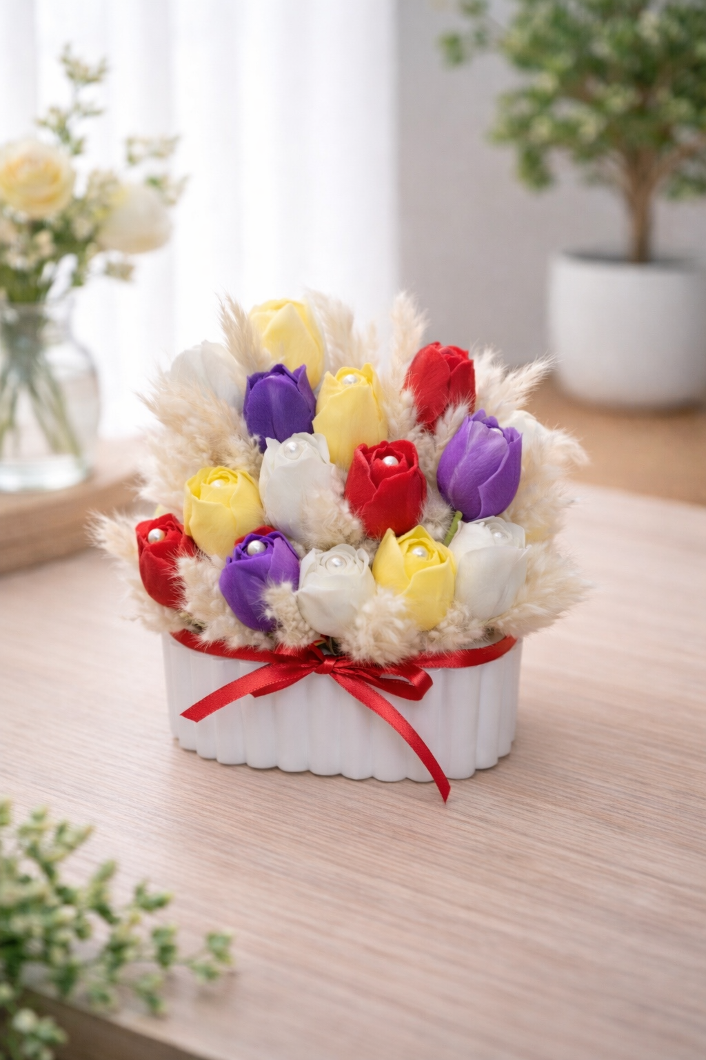 Handcrafted multicolor tulip candle arrangement with white, yellow, red, and purple tulips in a ceramic vessel, made in Connecticut by Candle Club Company.