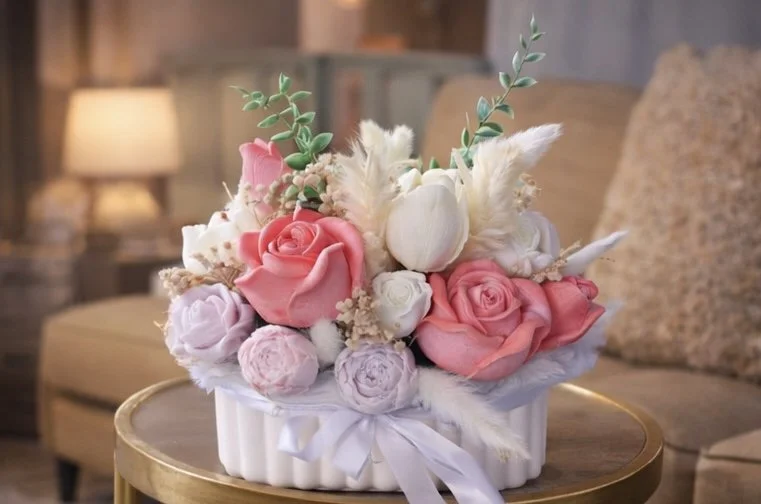 Eternal Bloom handmade rose centerpiece candle styled in a cozy living room setting