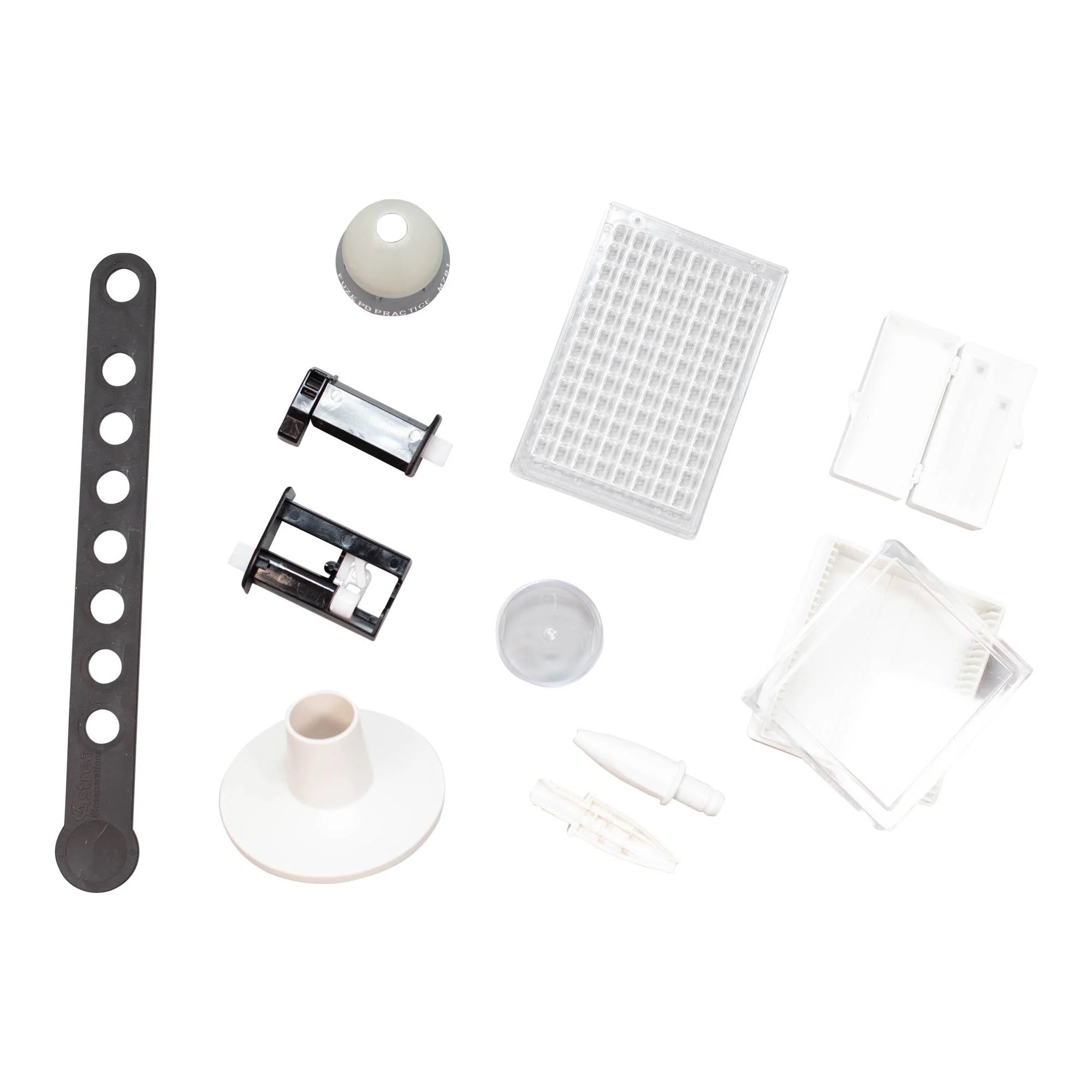 Collection of laboratory or medical test kit components including vials, plastic holders, and small tools.