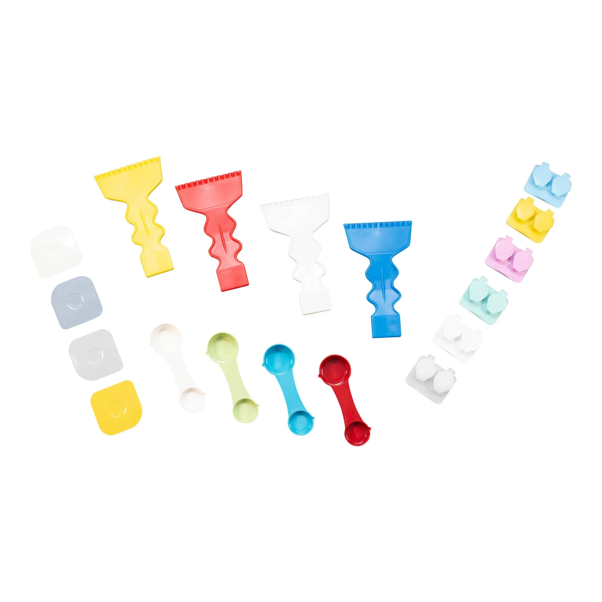 Colorful plastic game pieces including paddles, pawns, and small blocks arranged in a pattern.