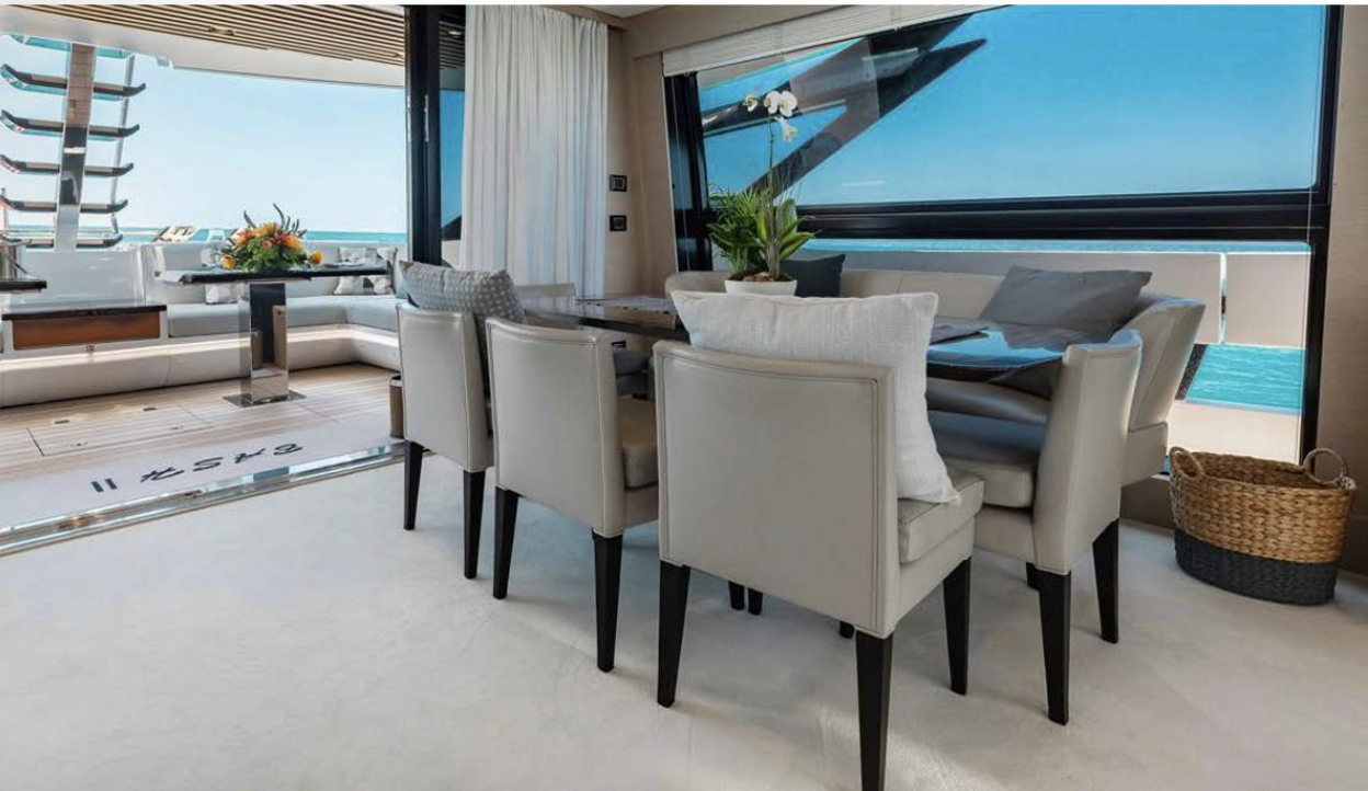 Luxury yacht interior with dining area and sea view