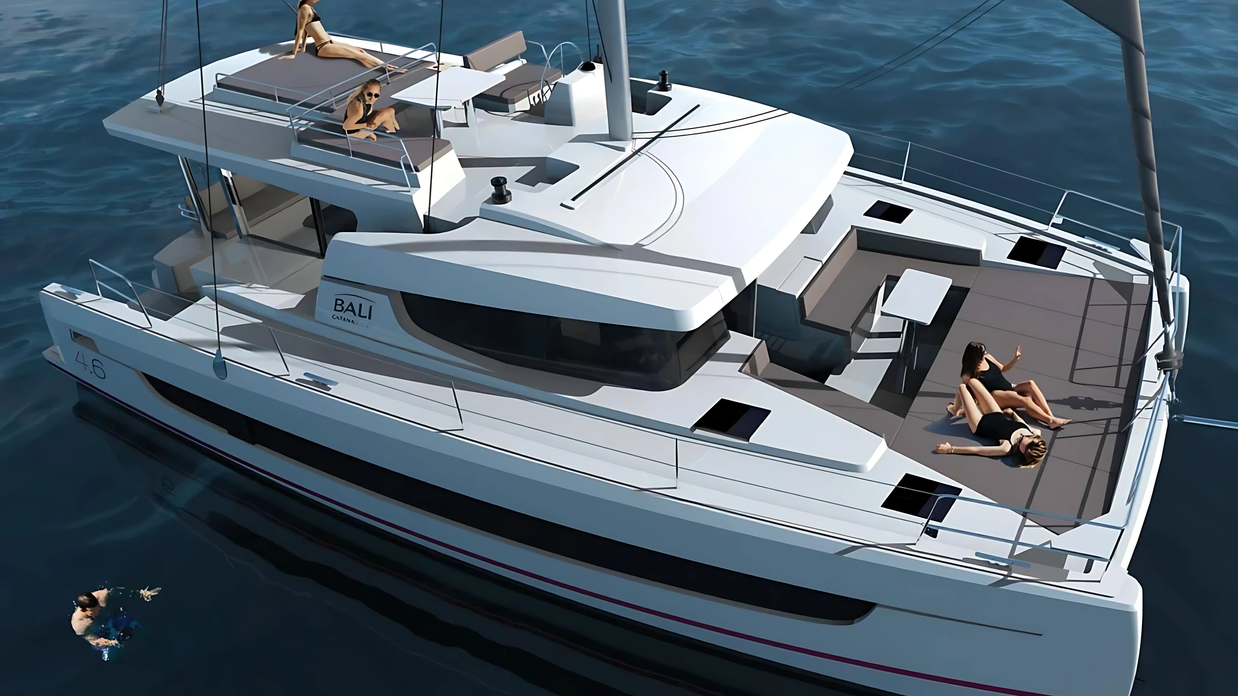Luxury catamaran on water with people sunbathing on deck and swimming nearby.