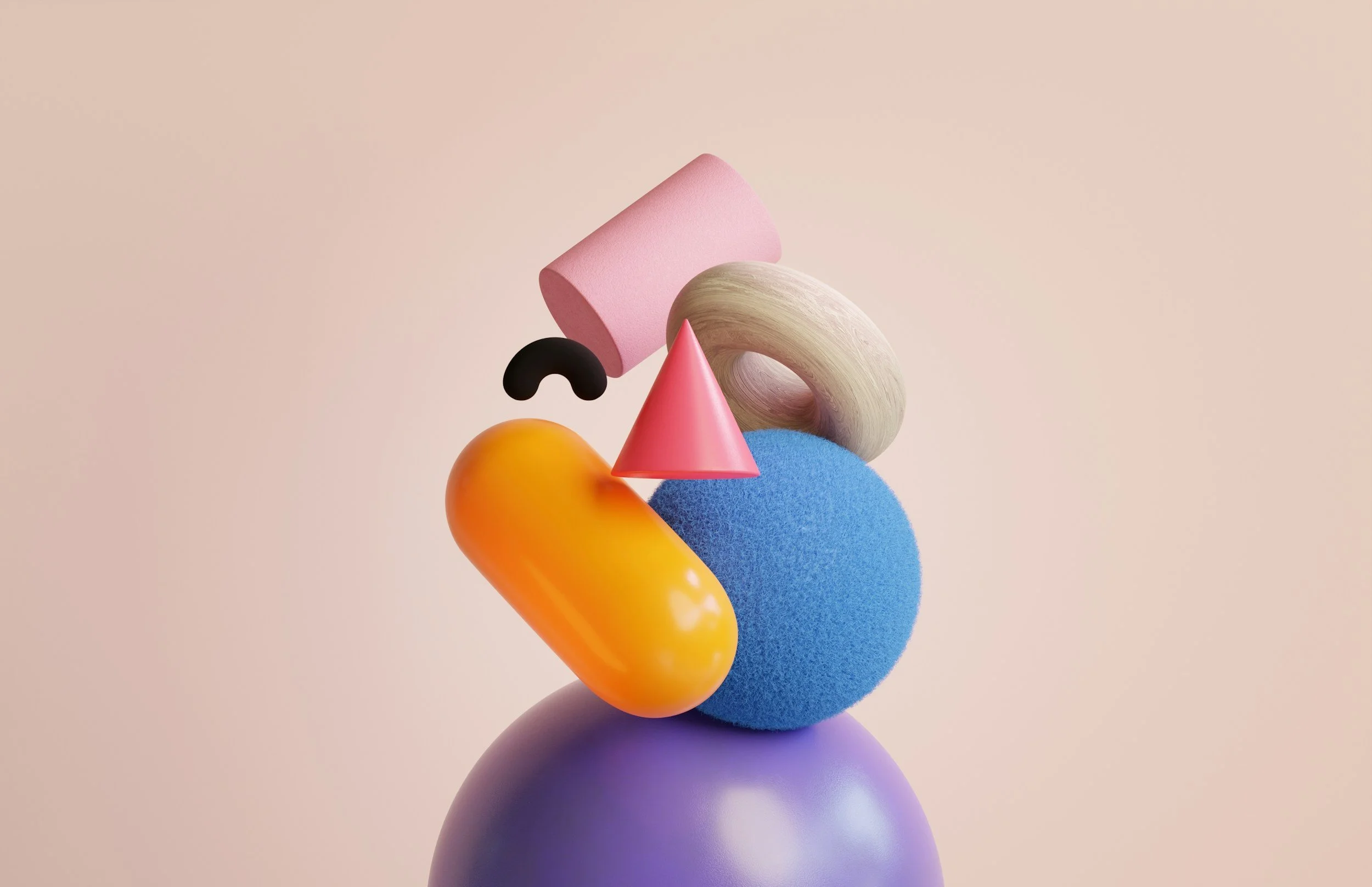 Abstract arrangement of colorful geometric shapes including a purple sphere, a blue textured sphere, an orange capsule, a pink cone, a black curved piece, a beige torus, and a pink foam cylinder on a light background.