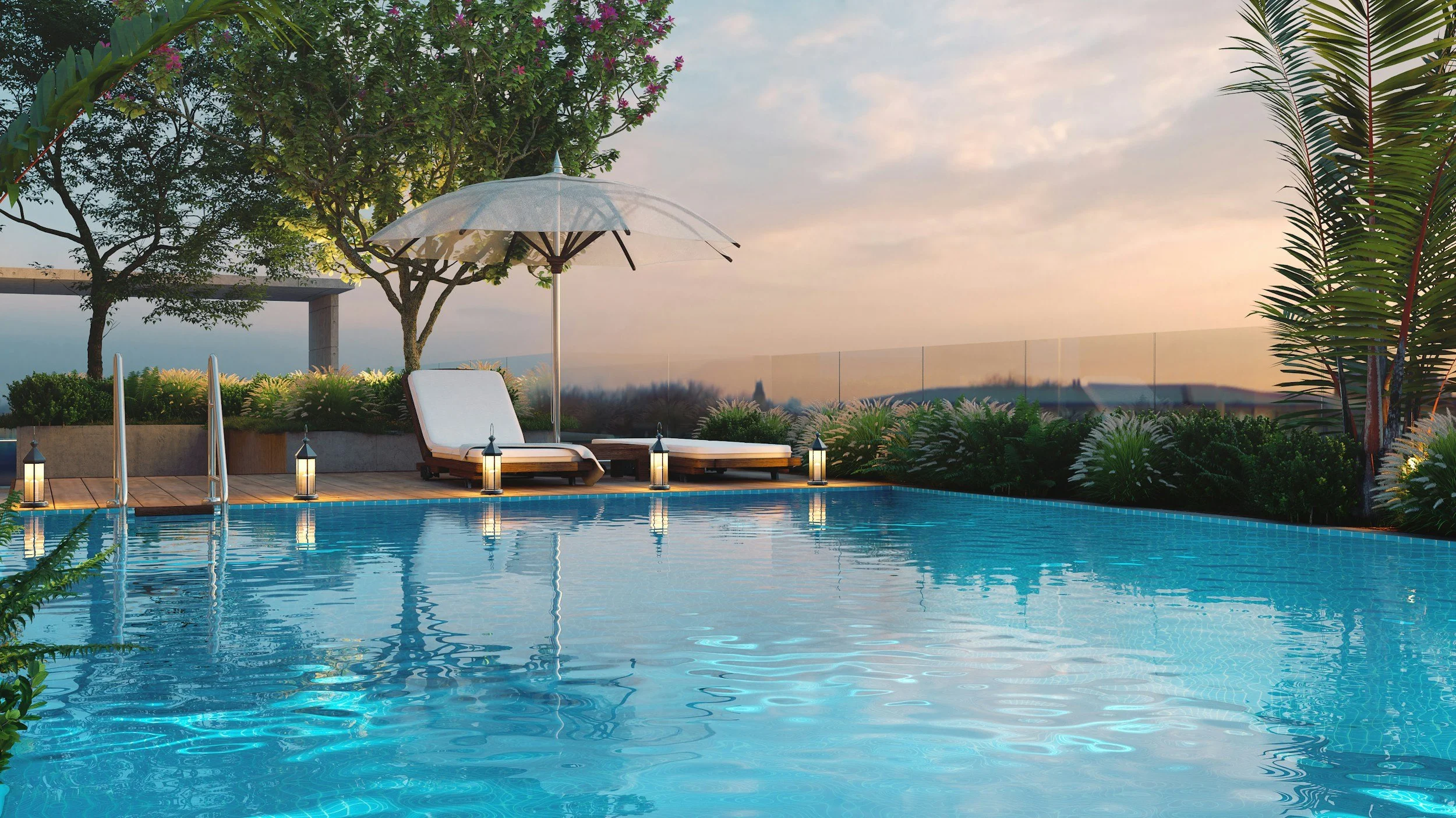 Rooftop swimming pool area at sunset with lounge chairs, umbrella, and lush greenery.