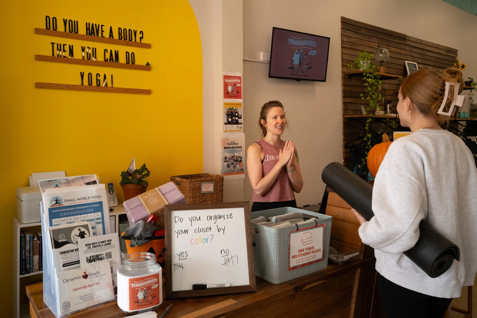 retail storefront in a yoga studio with a customer