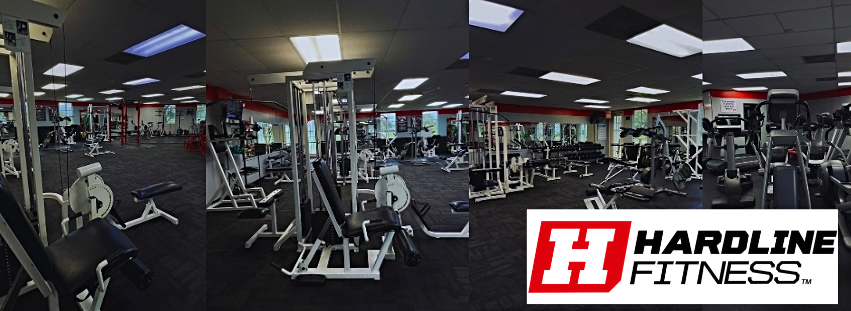 Interior of Hardline Fitness gym with various workout equipment and the fitness center logo.