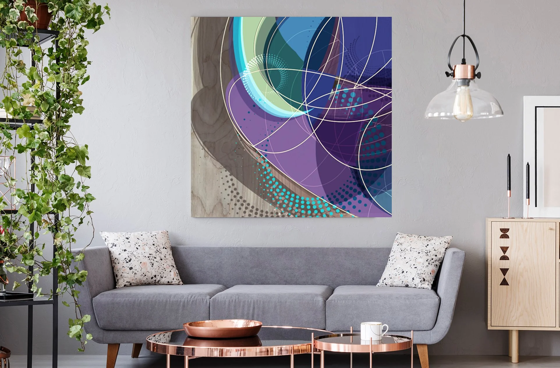 Abstract Design concept for letter O with fireflies and water patterns hanging in a family room above sofa