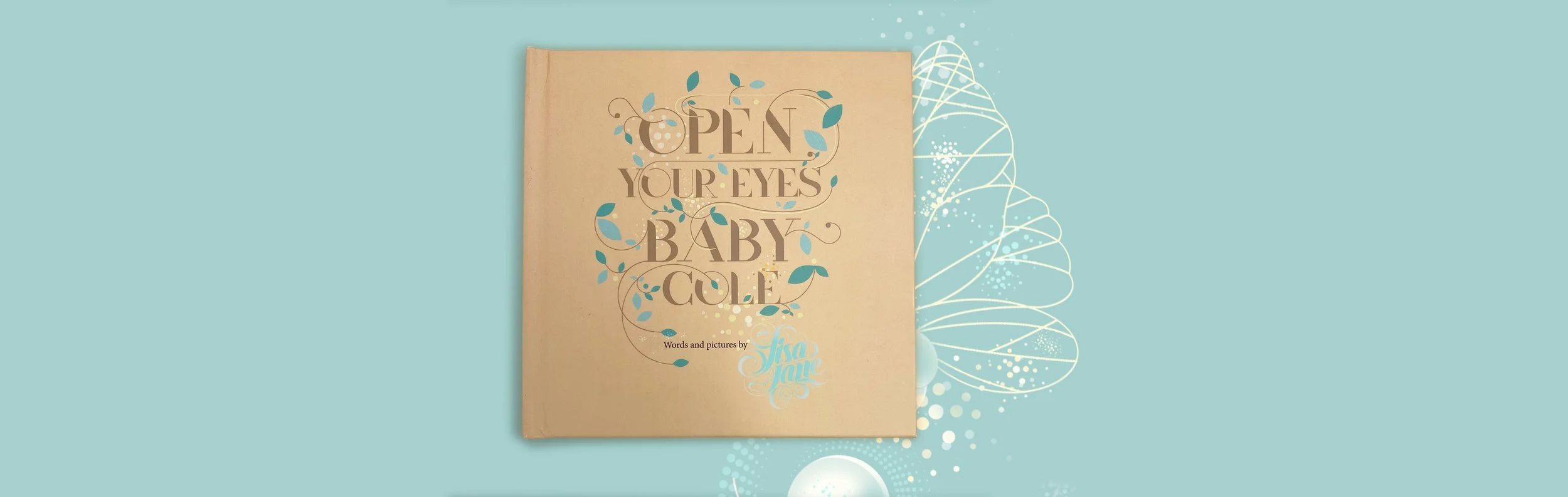 Open Your Eyes Baby Cole storybook with illustrated firefly and gold lettering on craft paper