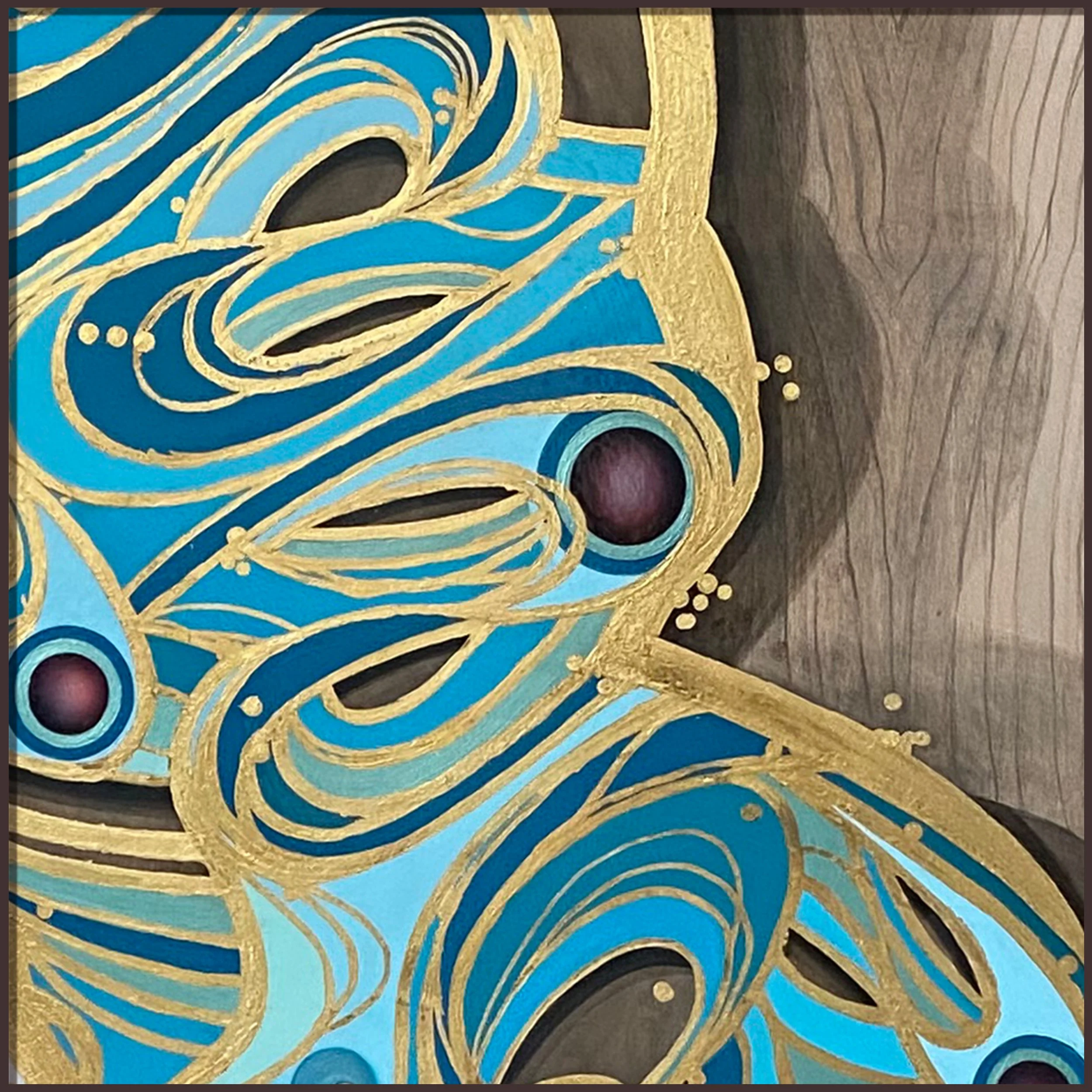 Hand-painting blue butterfly wing details on wood panel in studio