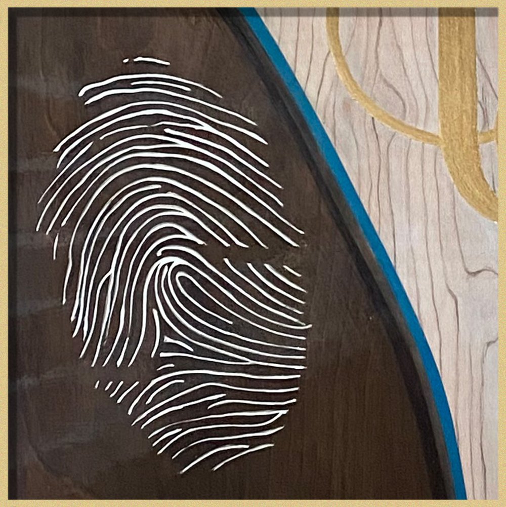 Fingerprint and gold leaf detail in corner of hand-painted memorial art