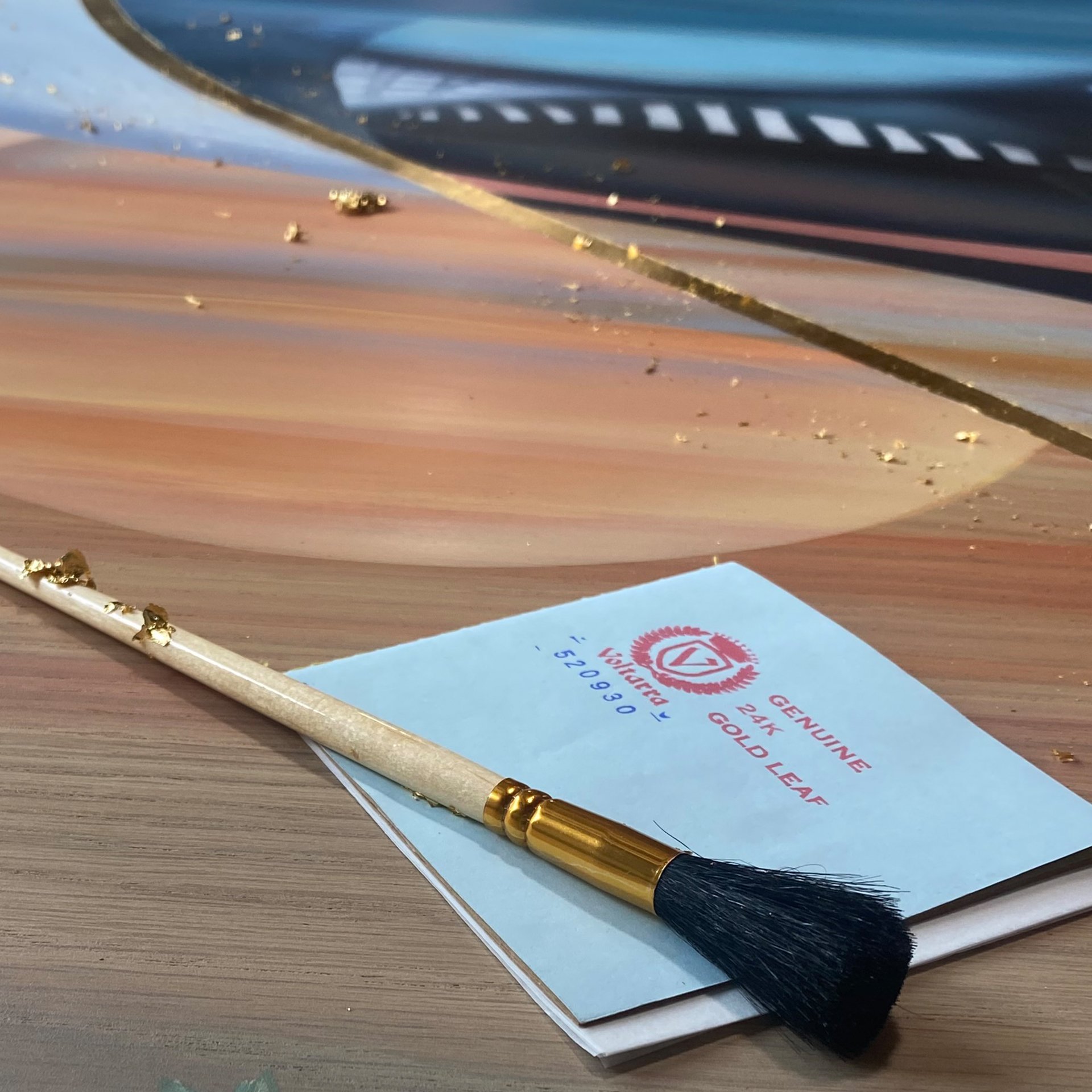 Hand-painted story art on natural wood with 24k gold leaf — Lisa Jane Design commission