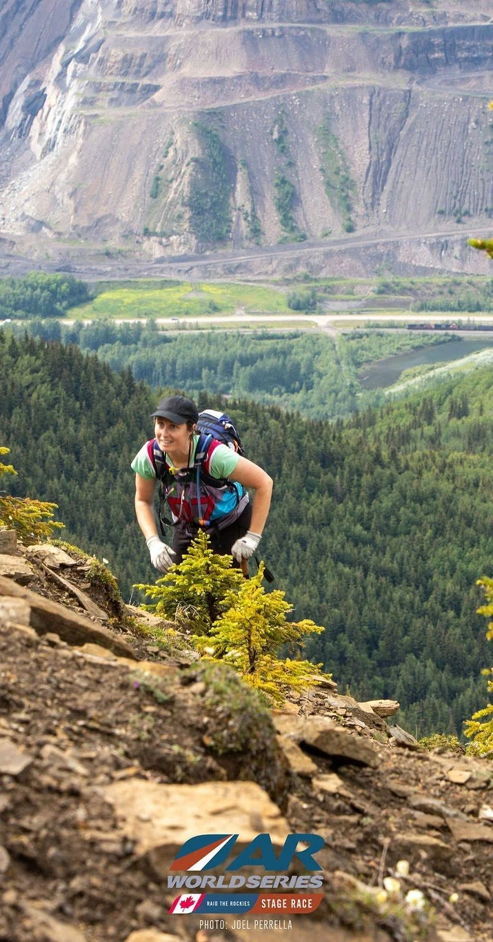 Raid the rockies athlete climbing a mountain