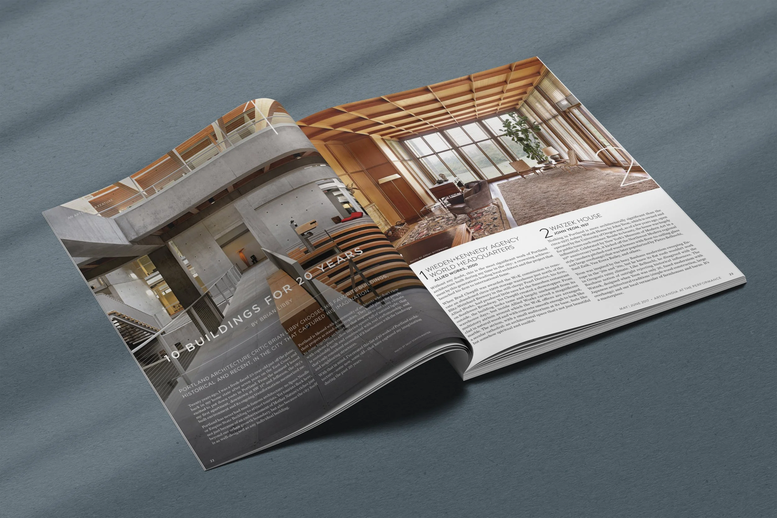 Open magazine spread featuring modern architectural interior images and article text.