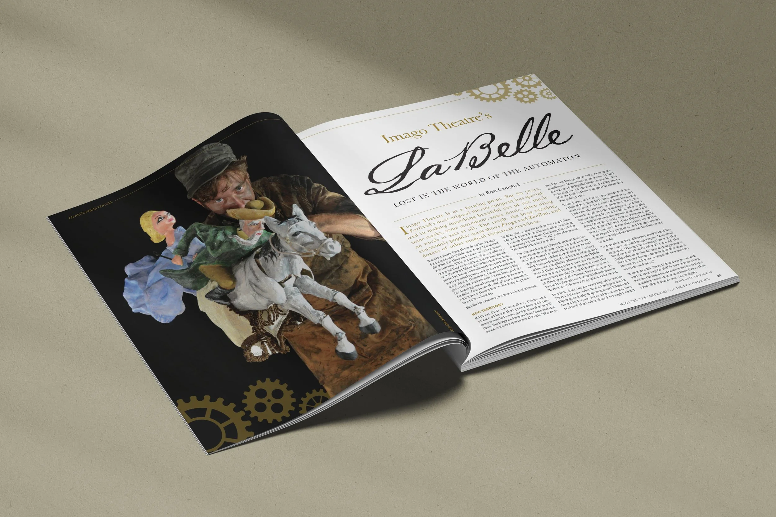 An open magazine featuring an advertisement for Imago Theatre's La Belle, a puppet show with a person holding a puppet of a woman on a horse, with gears in the background.