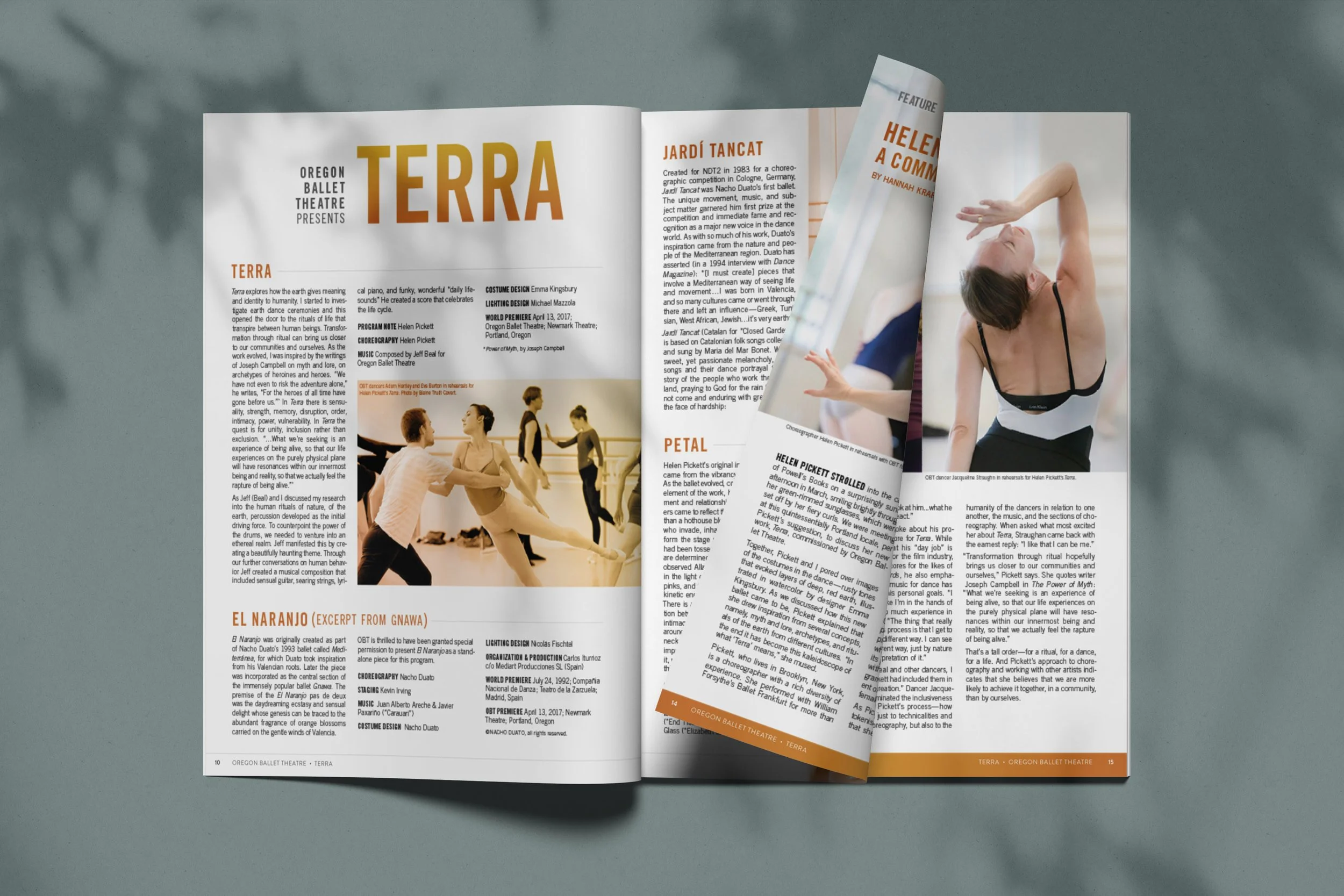 Open magazine featuring dance performances, with a woman in a black and white dance costume as part of a photograph on the right page.