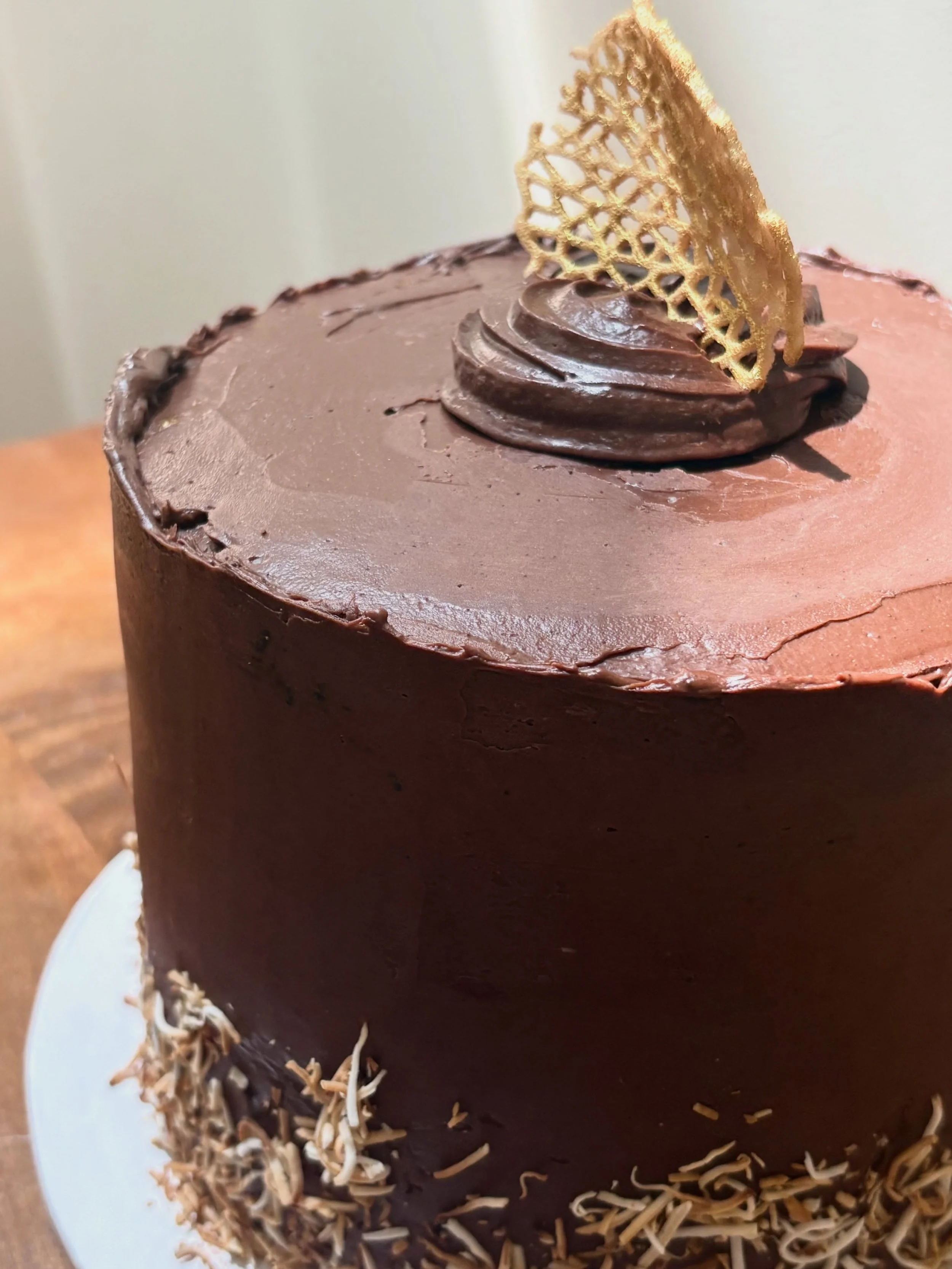 Not to be dramatic, but this German chocolate cake was the absolute crowd favorite at the party (and just happened to be vegan and gluten free). My biggest regret? That the gold of the cute lil decorative moment on top didn&rsquo;t come through in th