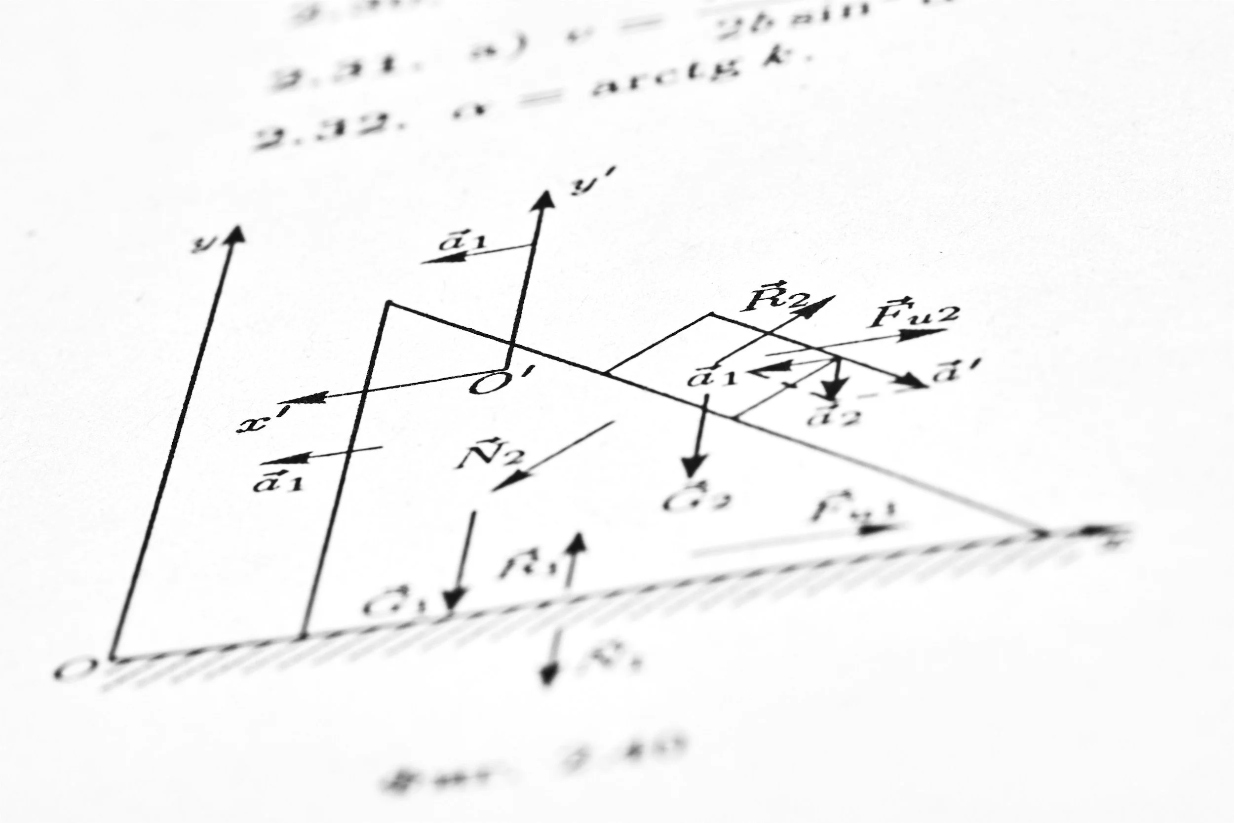 A close-up of a scientific or mathematical diagram featuring vectors, arrows, and labels on a white sheet of paper.