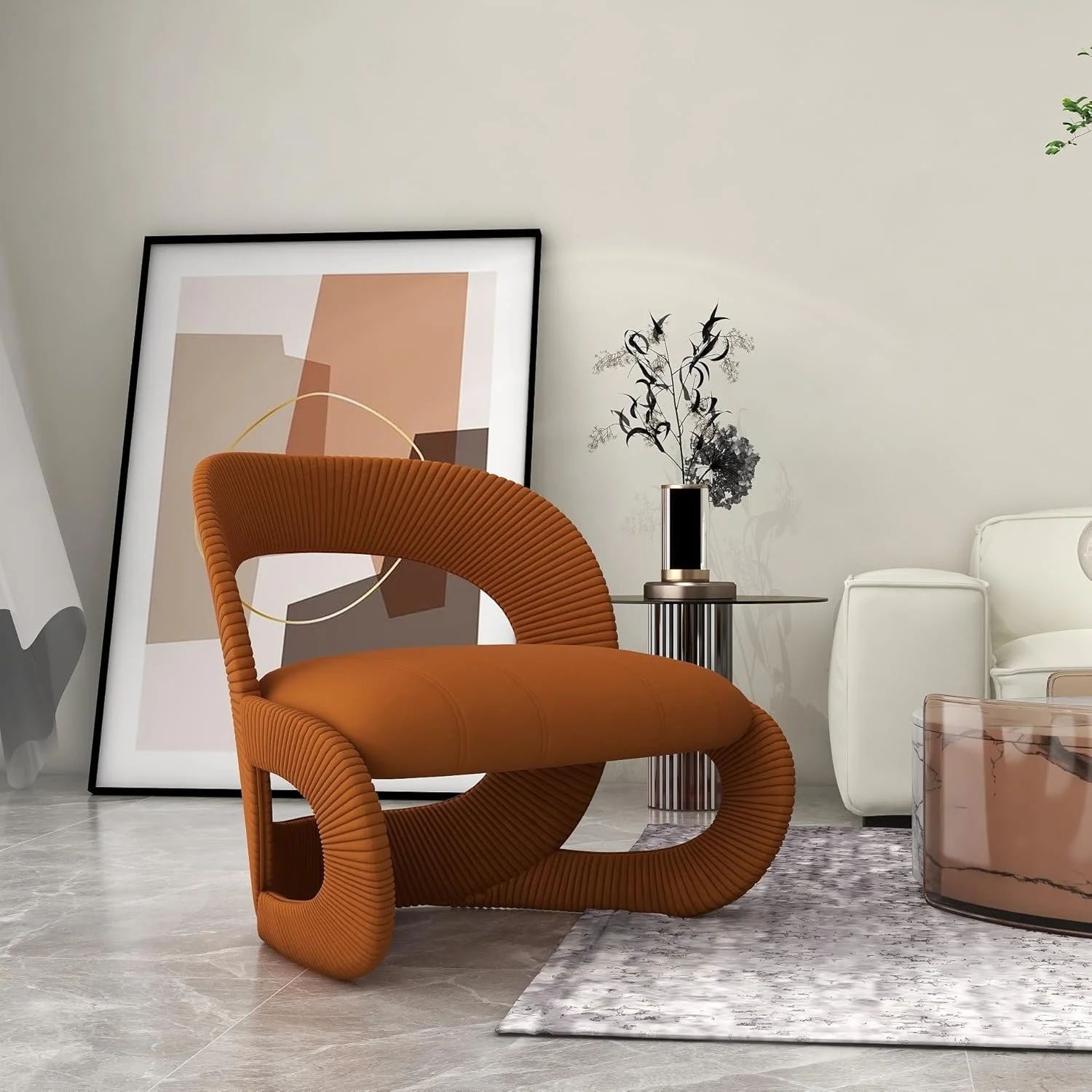 Modern living room with orange sculptural chair, abstract artwork leaning against the wall, black vase with dried branches on a glass side table, white sofa, and a transparent pink coffee table.