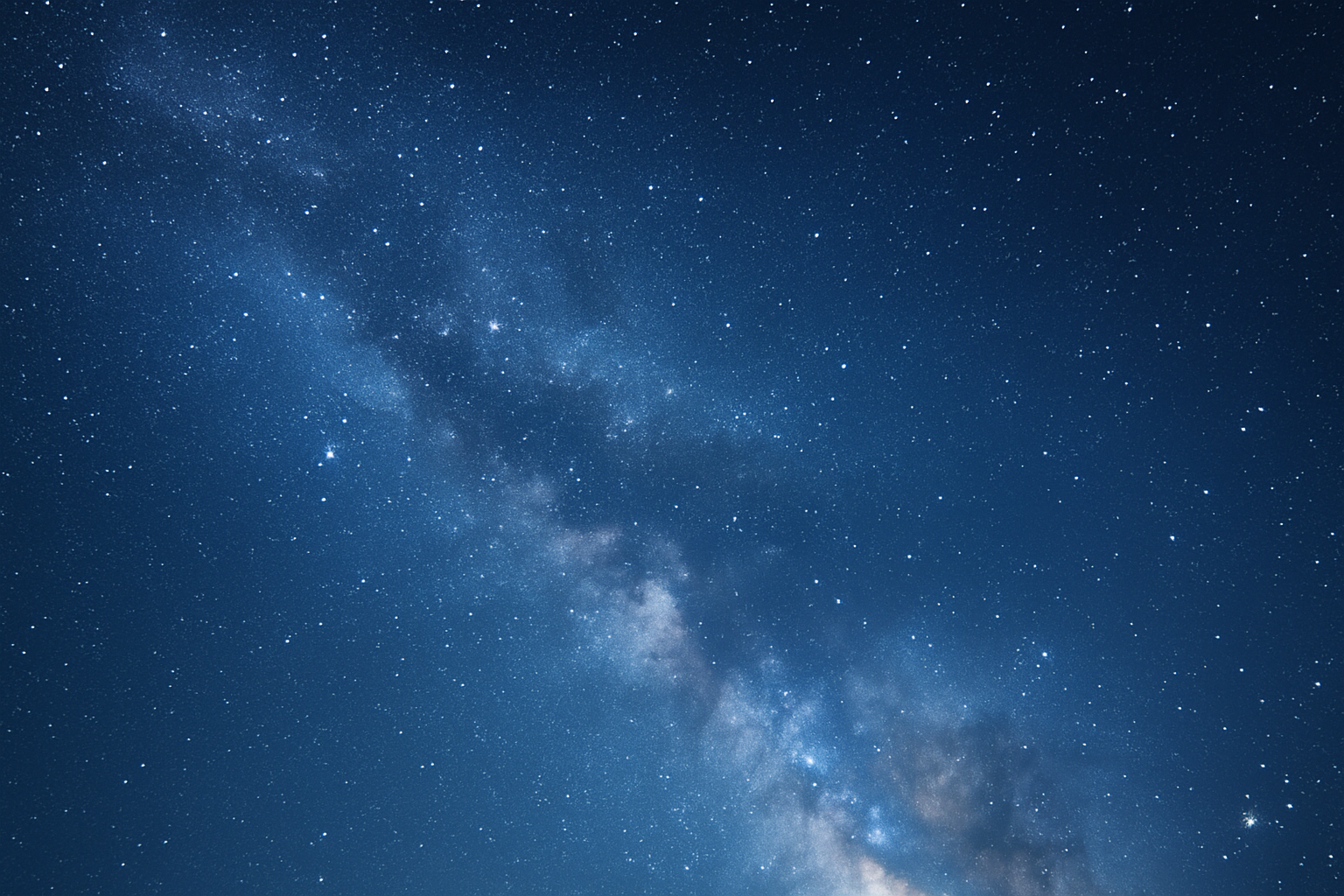 Clear night sky filled with numerous stars and the Milky Way galaxy.