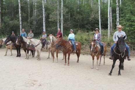 An image of eight individuals on horseback at the MIDA Mountain Veterans Program.