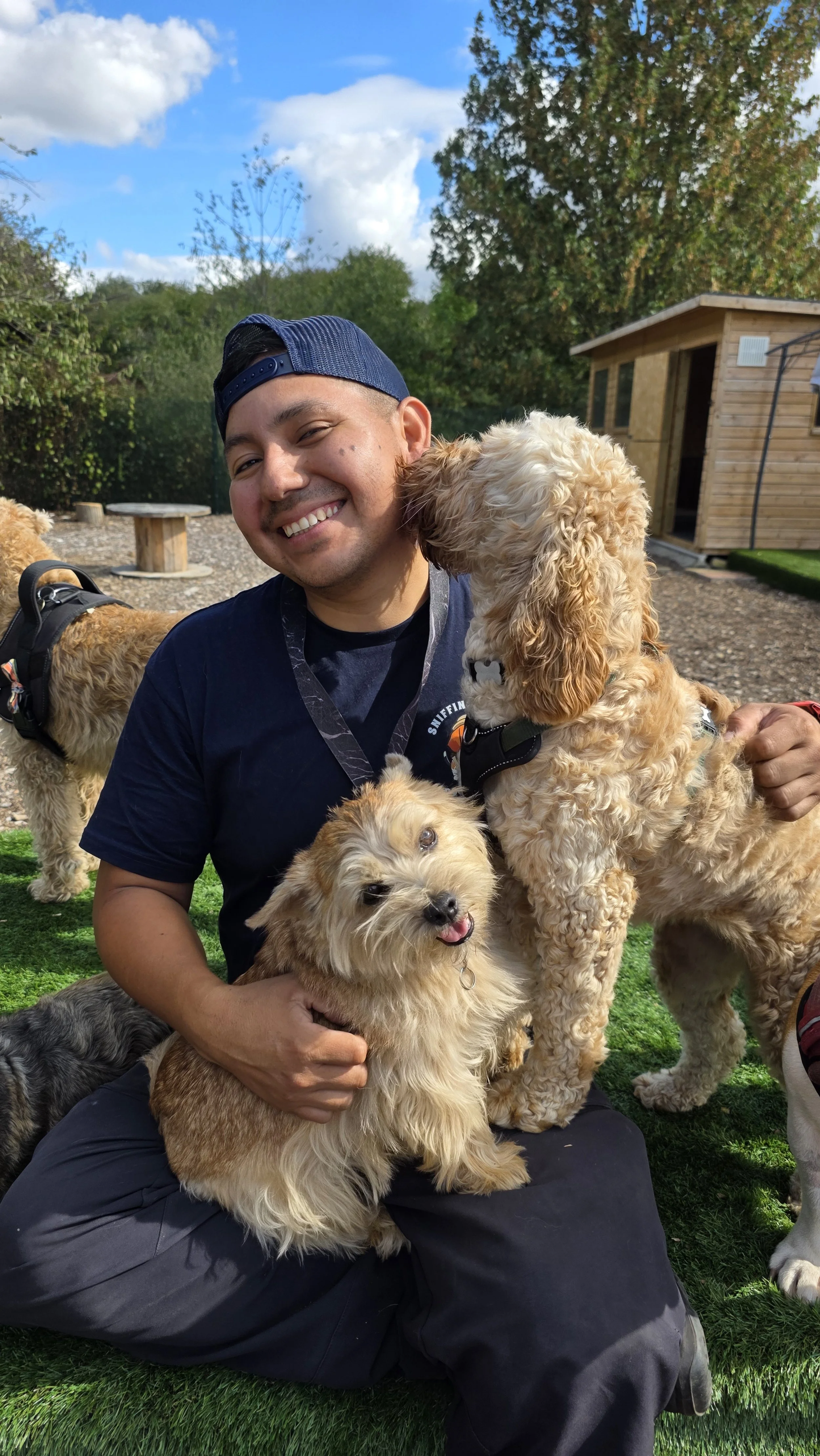 Manolo smiling with dogs