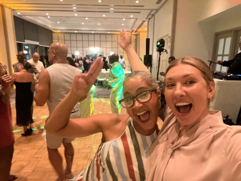 Joyful moment at a lively Puerto Rico micro-wedding celebration, featuring a diverse couple and guests cheering. Inclusive ceremony experience.
