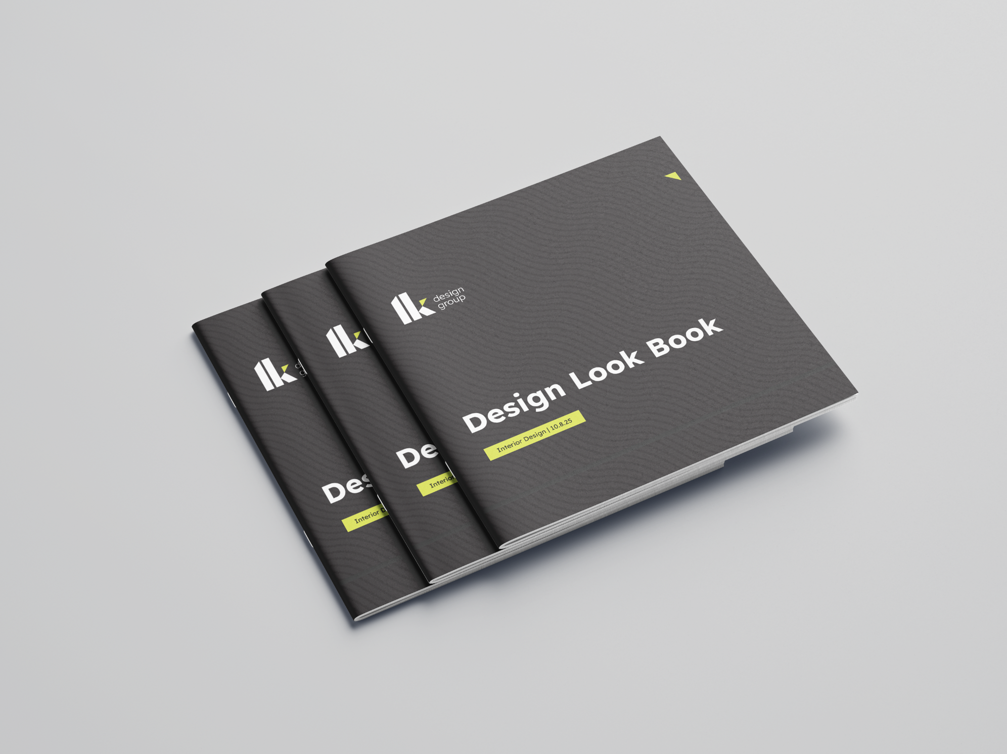 Three black booklets titled 'Design Look Book' with a logo and yellow highlights, arranged on a white surface.