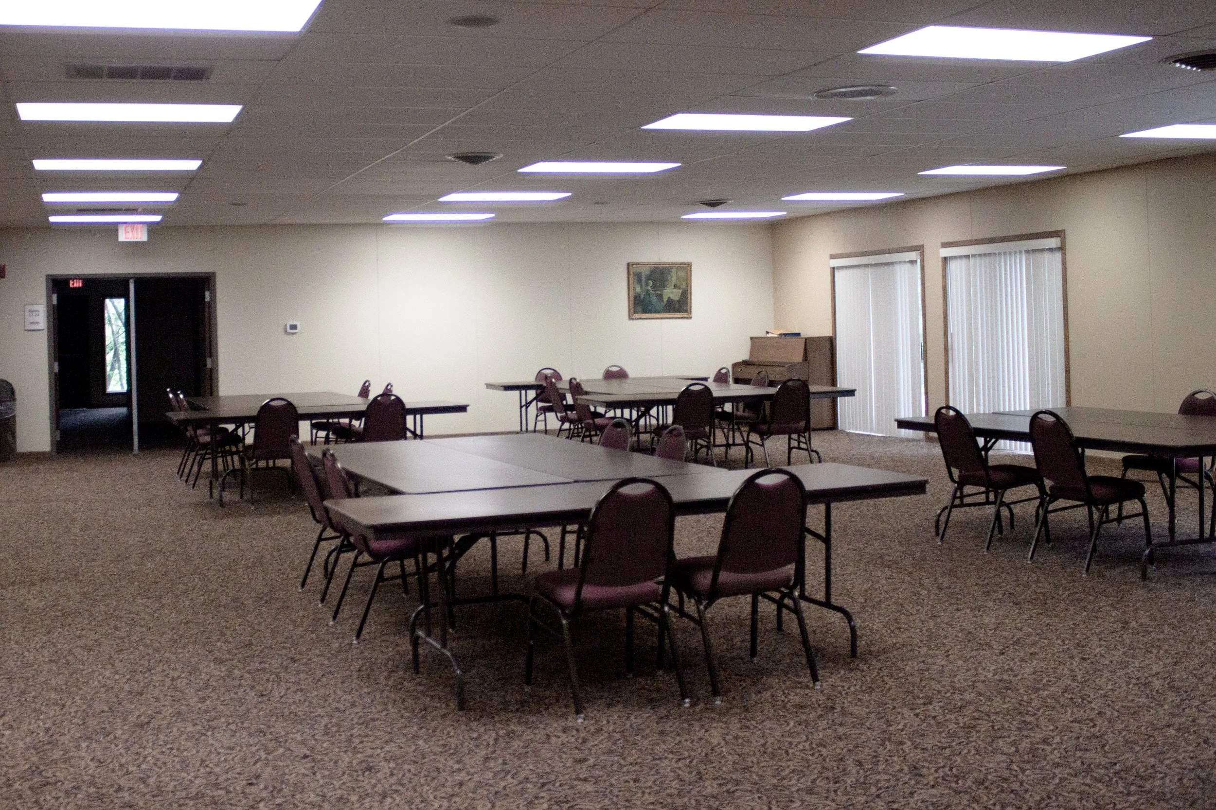 Meeting space at Calvin Crest with tables and chairs.