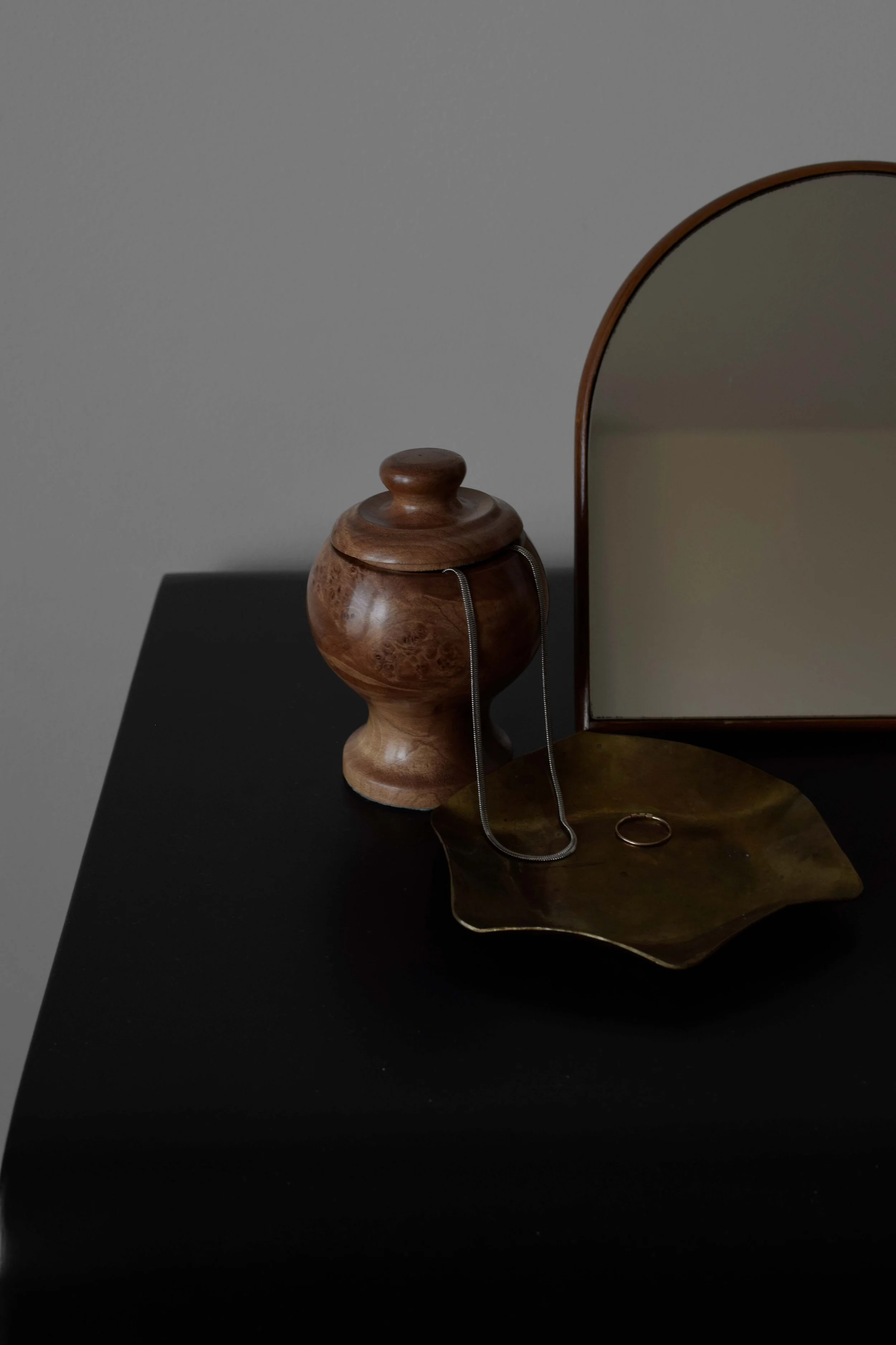 Jewelry prop styled on top of a black vanity