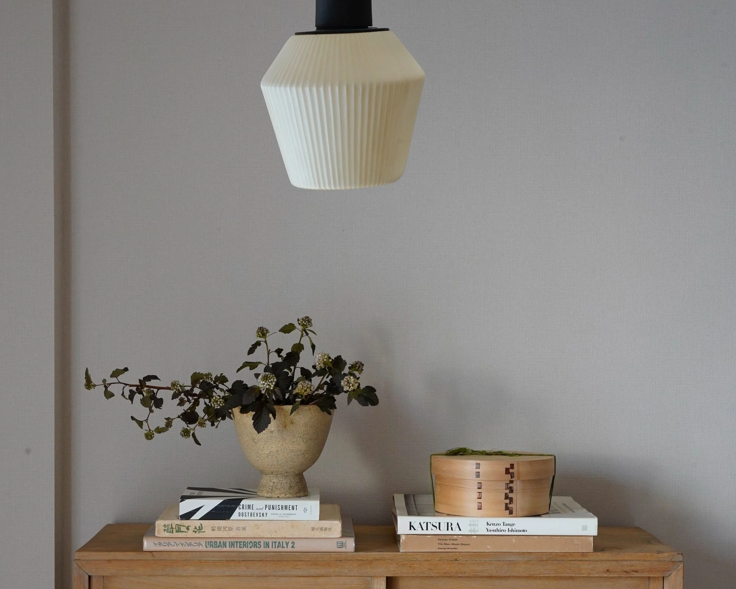 Floral arrangement and prop styling on top of a cabinet