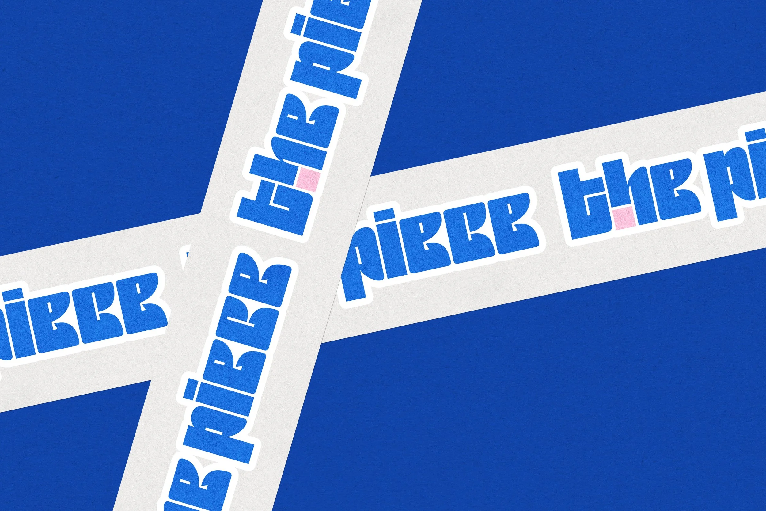 Close-up of three white rectangular stickers with blue text, overlapping each other on a blue background.