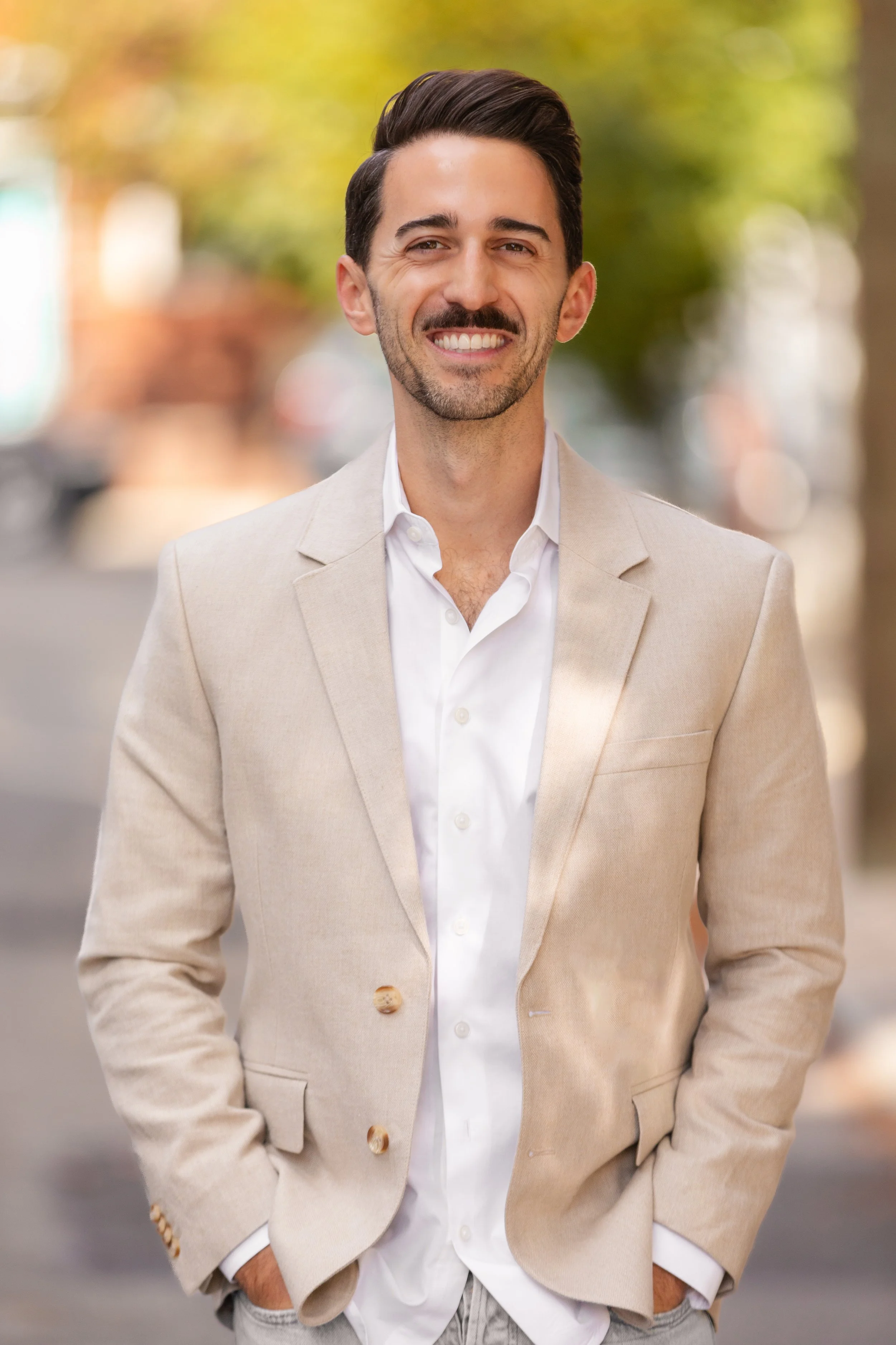 Psychiatrist, Phillip Orlando's headshot on a bright sunny street in Rittenhouse Square, Philadelphia