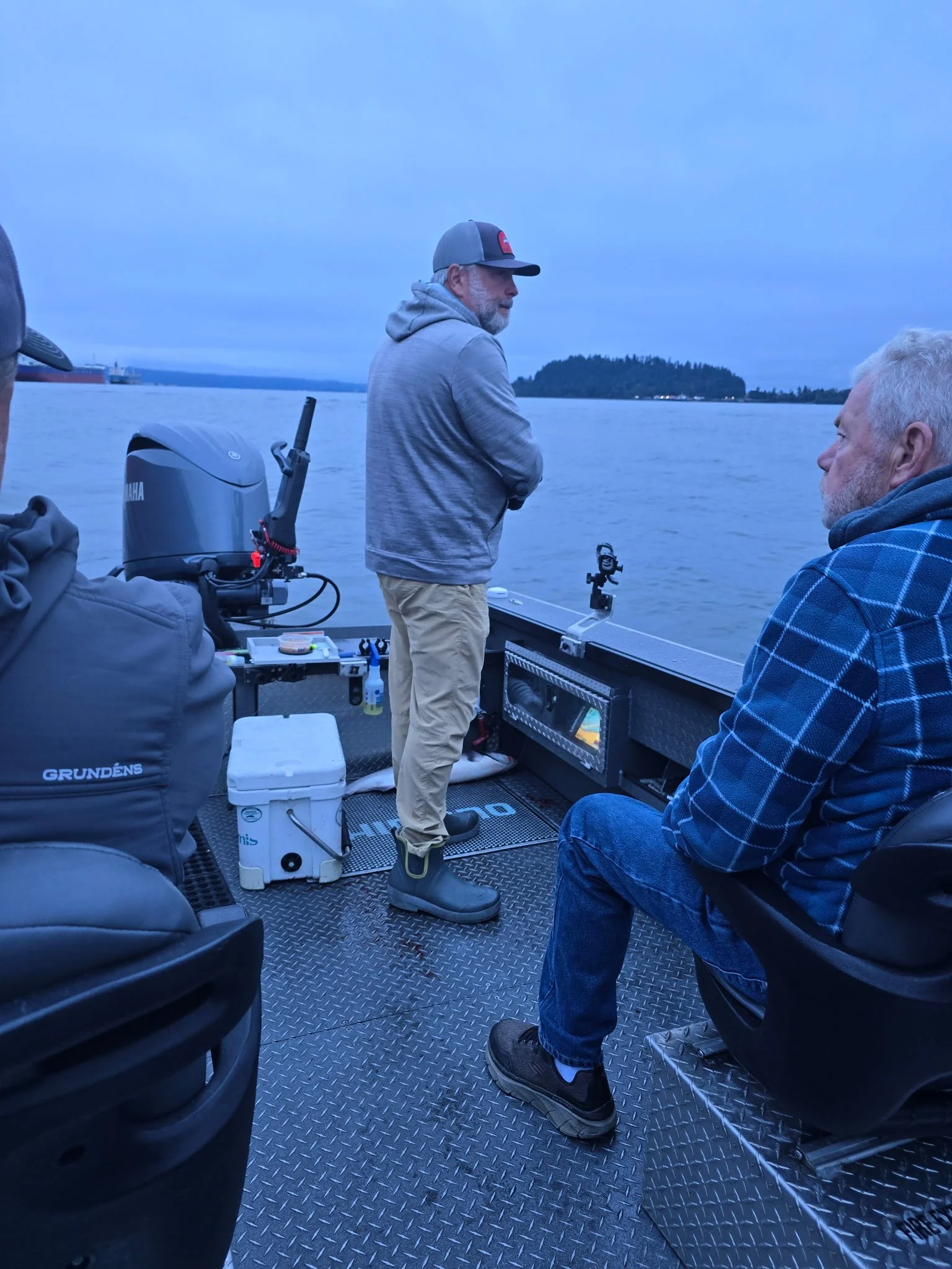Customer wearing Tahma low-cut boots on boat on a cold morning