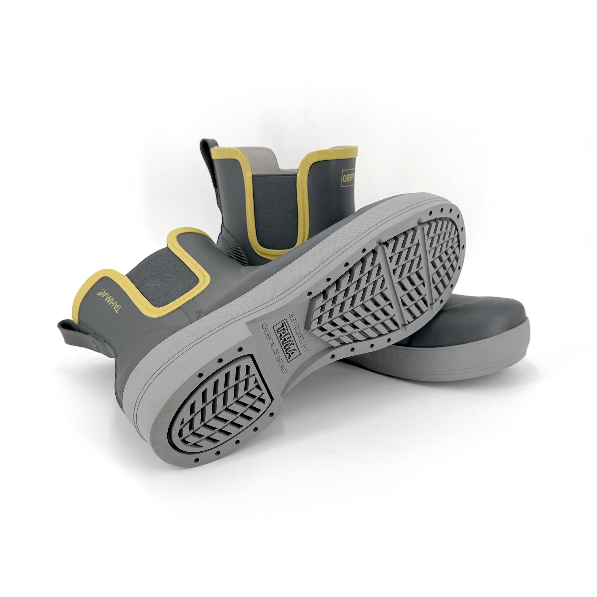 Tahma Low-Cut 7 inch boots resting on top of each other with a visible tread and sole on a white background