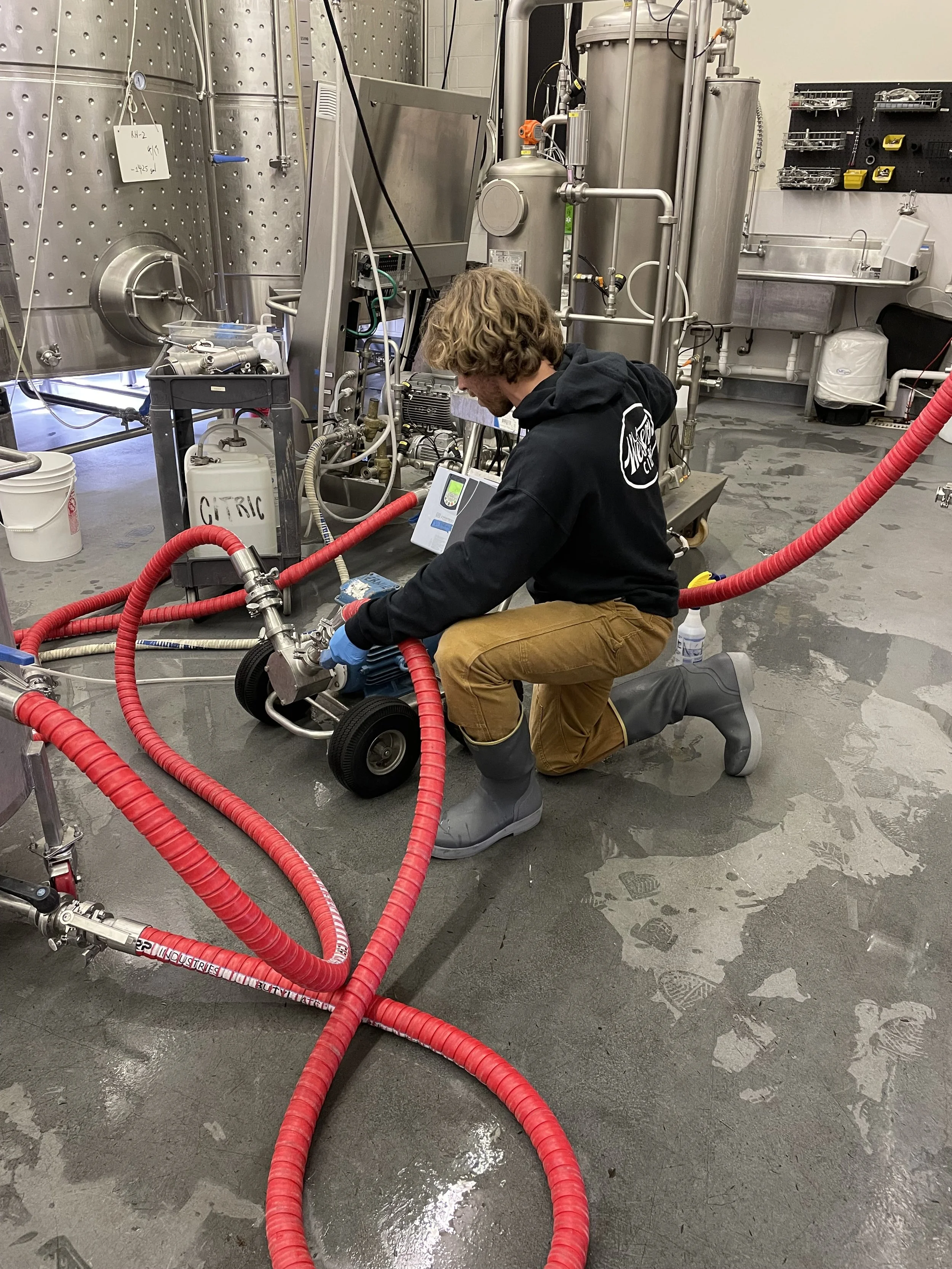 Customer wearing 15 inch tall Tahma boots at a brewery