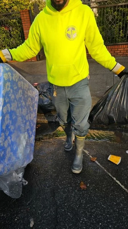 Tahma safety toe boots worn by a sanitation worker on site